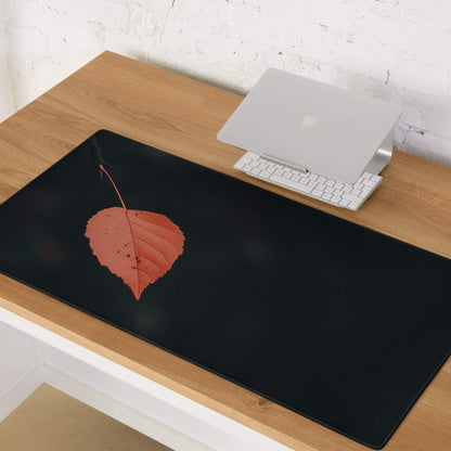 Black minimalist leaf gaming mouse pad with orange leaf design