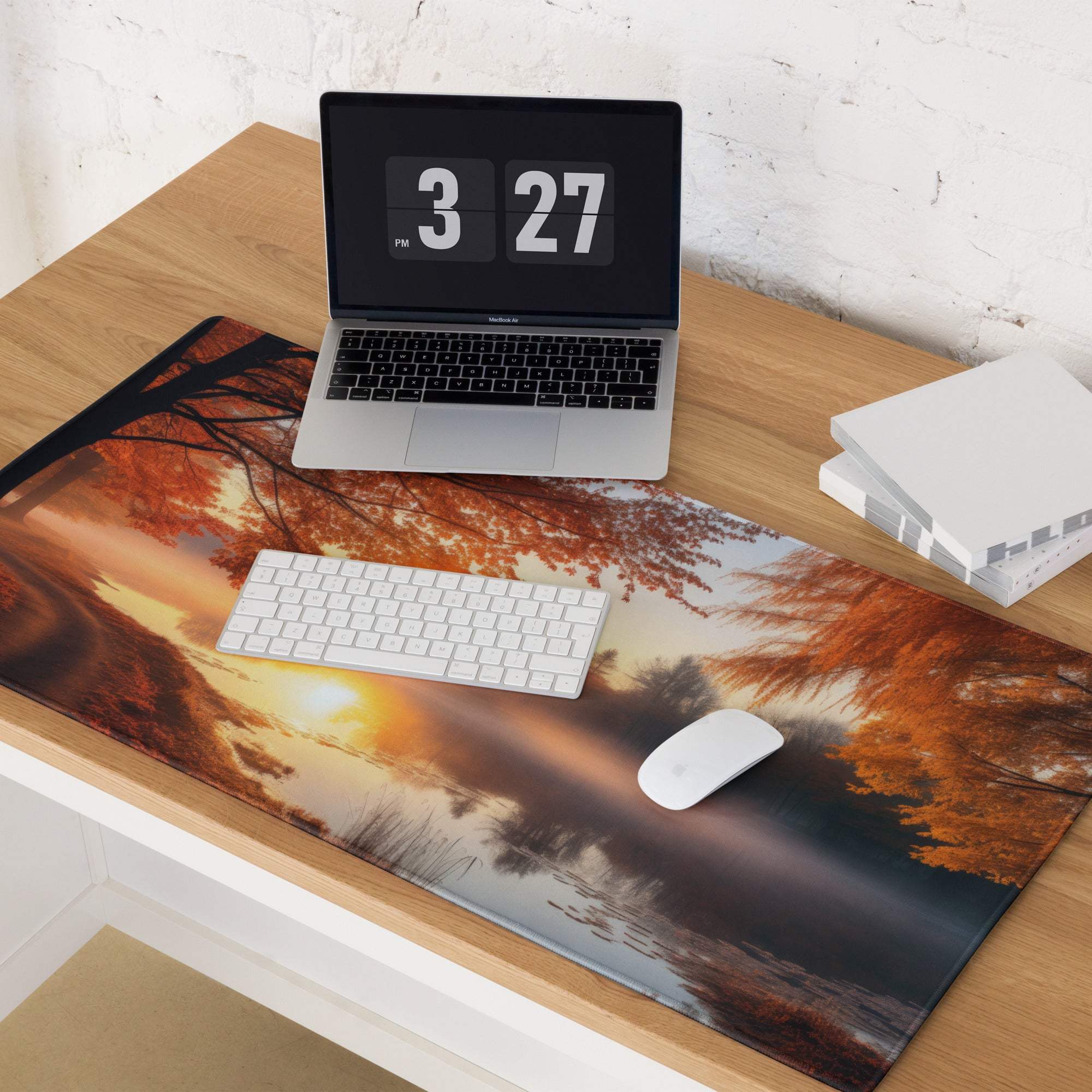 Large nature-inspired autumn sunset gaming mouse pad on wooden desk