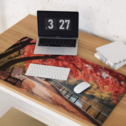 Autumn landscape gaming mouse pad with red leaves, bench, and riverside path