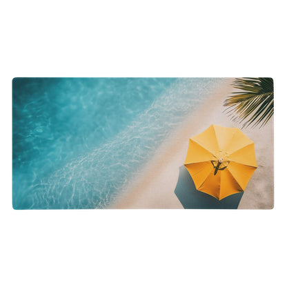 Bright yellow beach umbrella with black handle on sand beside turquoise water on oceanic beach gaming mouse pad