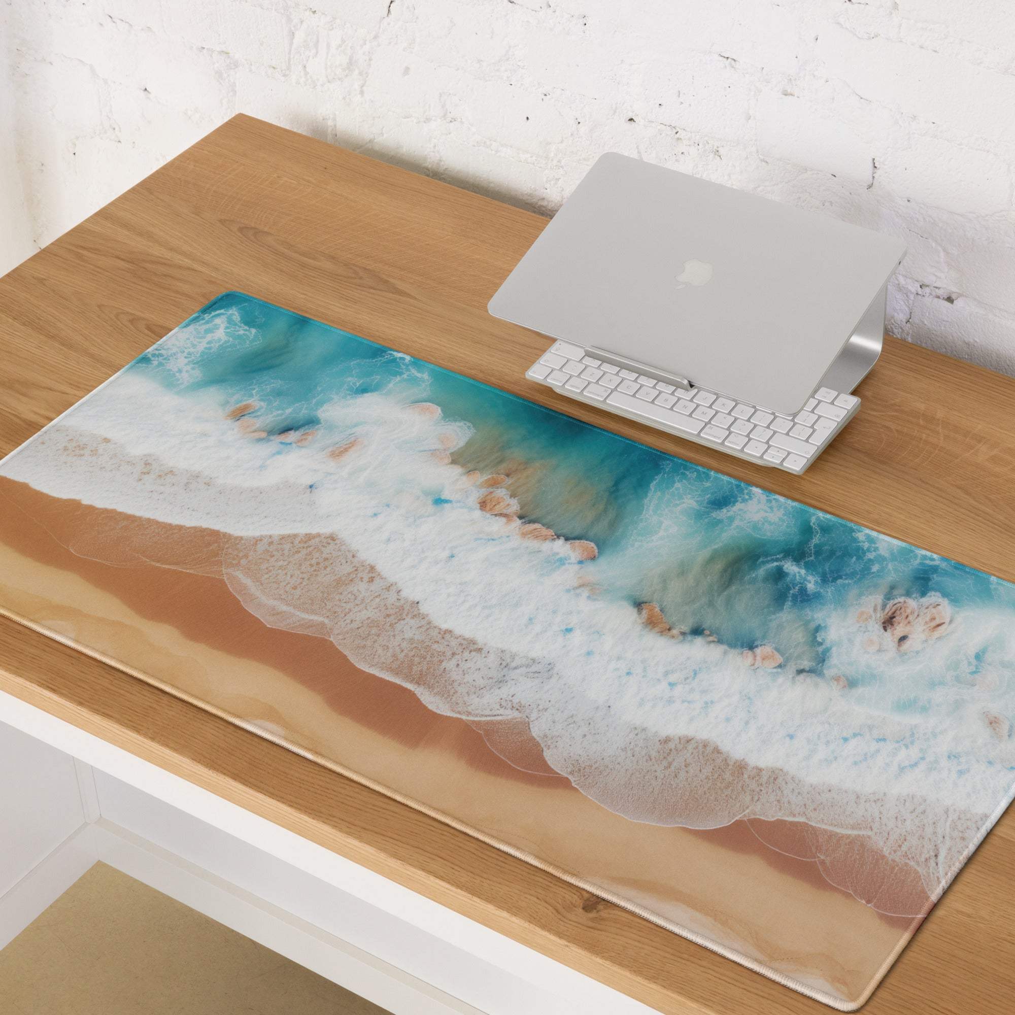 Large turquoise ocean wave gaming mouse pad with beige design and glossy finish