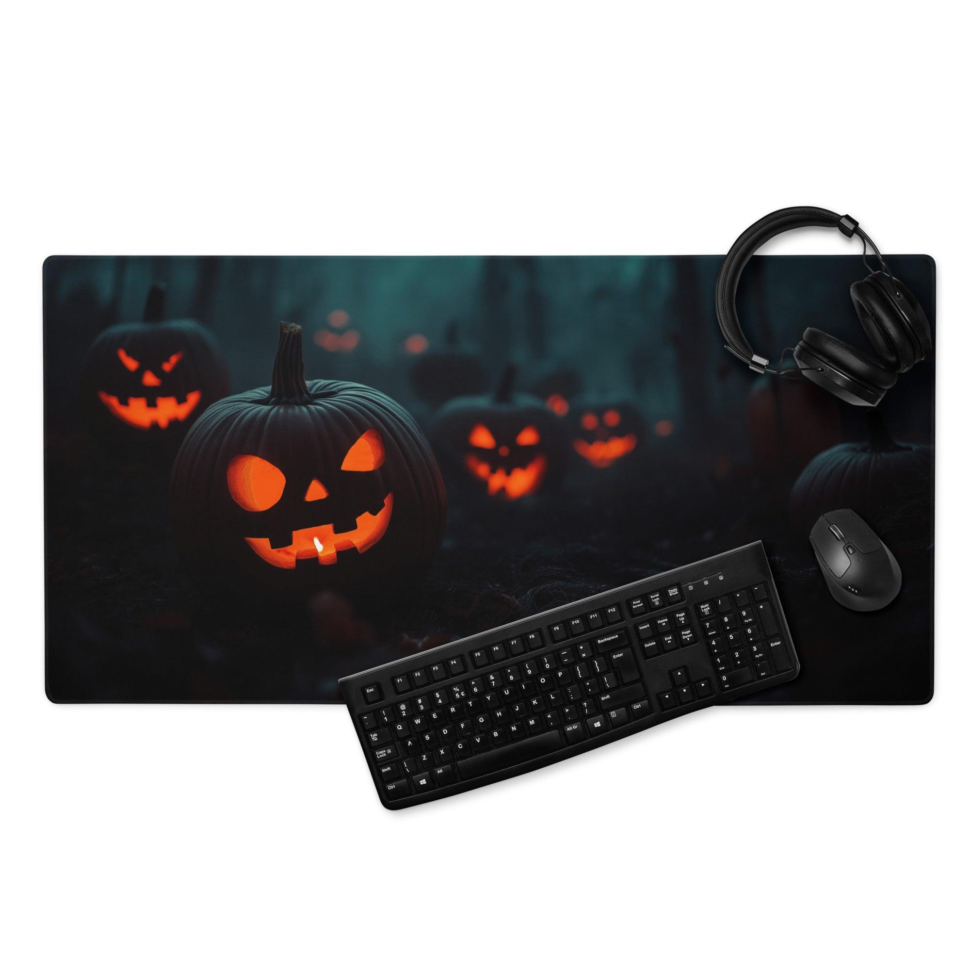 Black rectangular Halloween gaming mousepad with glowing orange jack-o-lanterns on dark forest backdrop