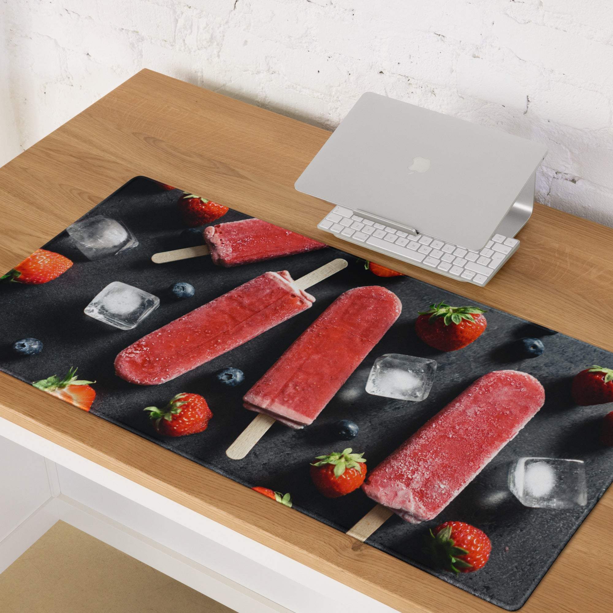 Large gaming mouse pad with strawberry popsicles, berries, ice on black slate