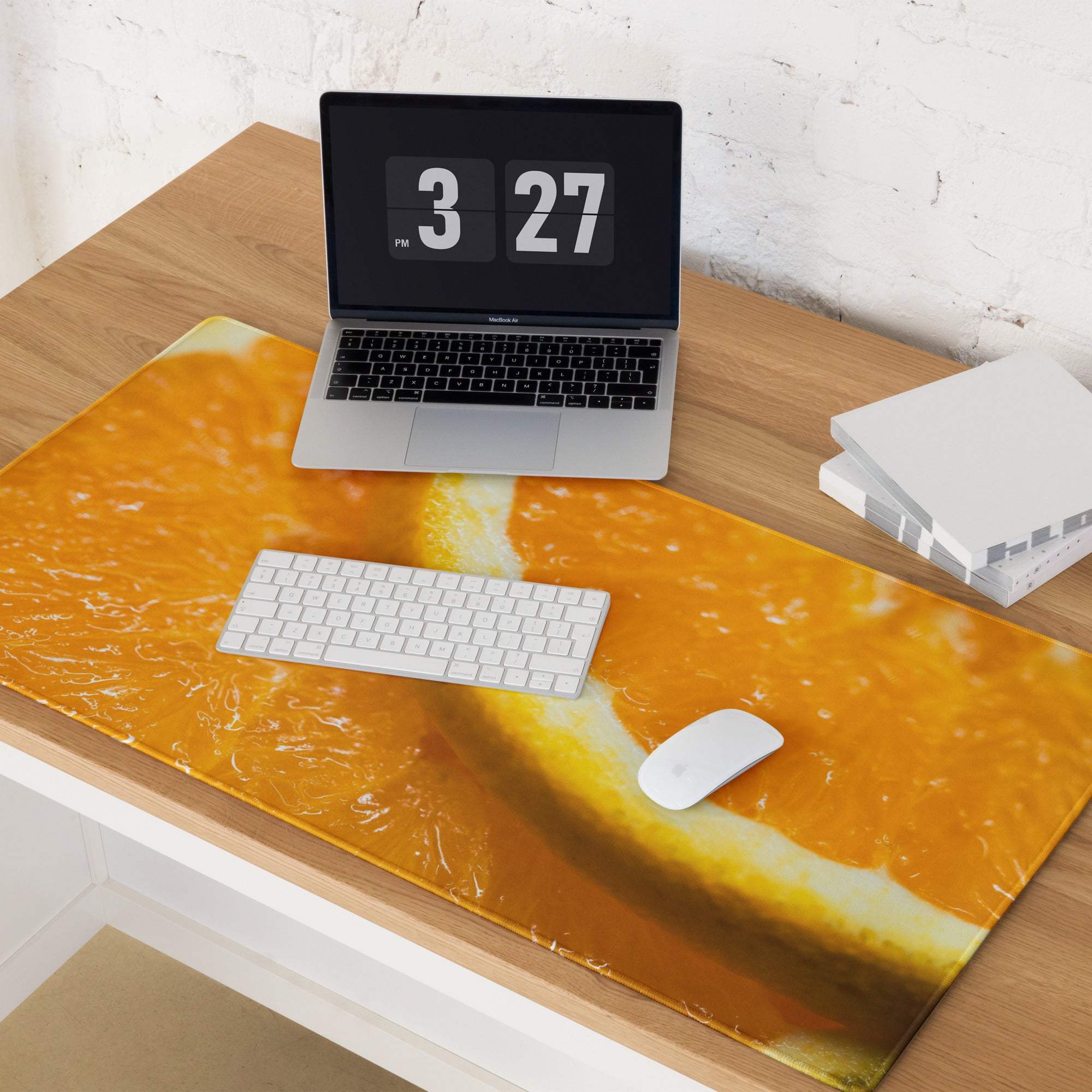 Vibrant orange slice gaming mouse pad with glossy finish and non-slip base