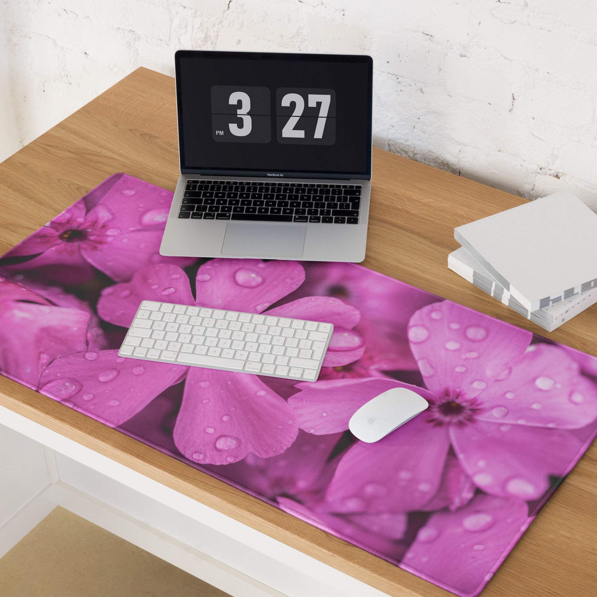 Vibrant pink floral gaming mouse pad with water droplets, non-slip base, stitched edges