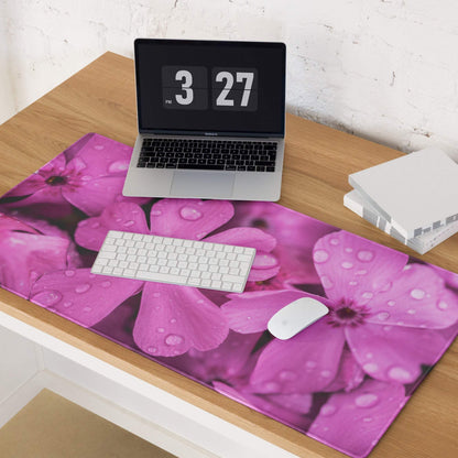 Vibrant pink floral gaming mouse pad with water droplets, non-slip base, stitched edges