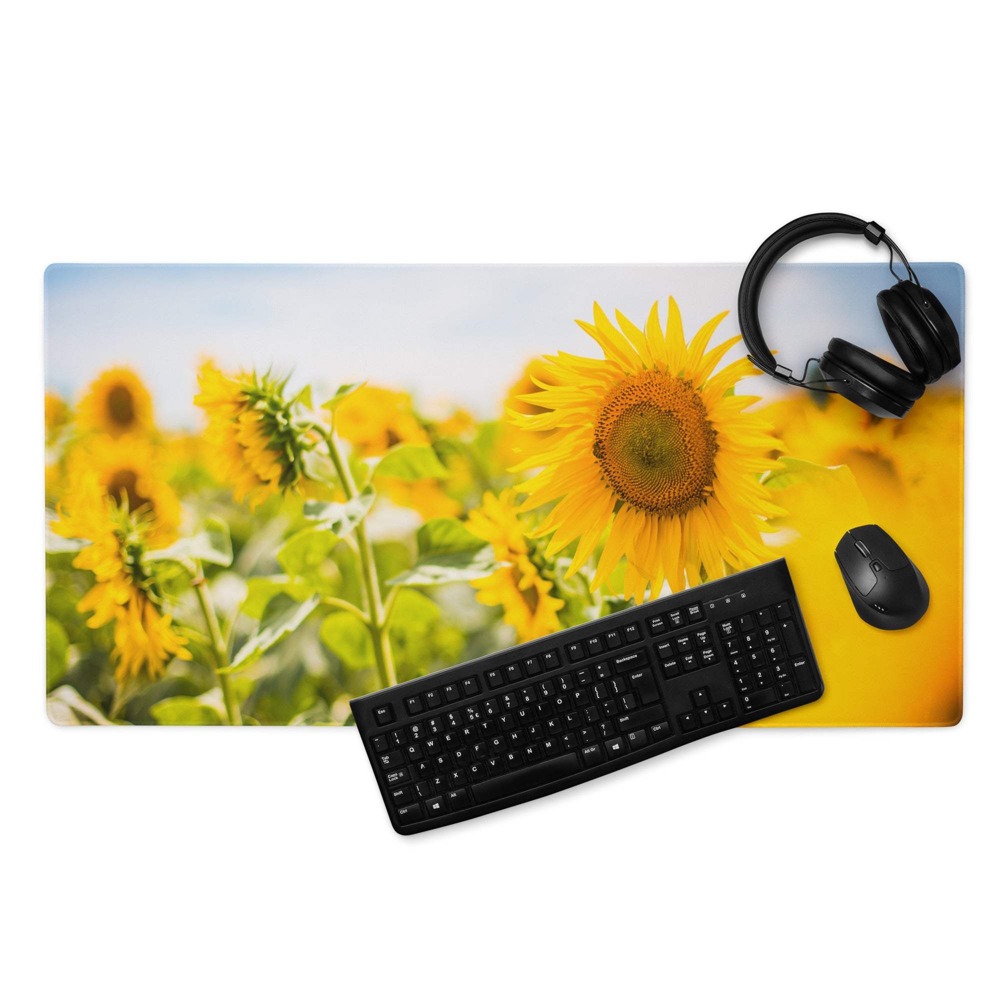 Vibrant yellow sunflower field gaming mousepad with black keyboard and mouse