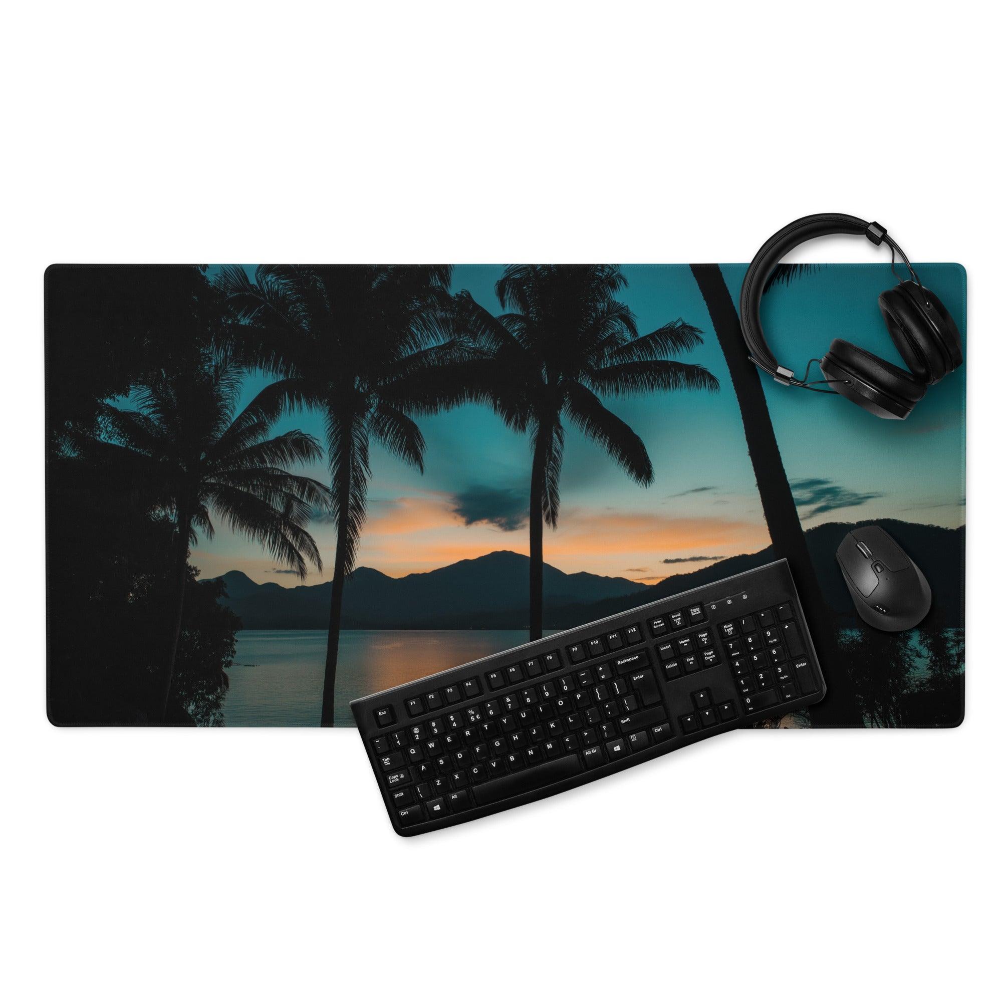 Black keyboard on Tropical Sunset gaming mouse pad with teal orange palm scene
