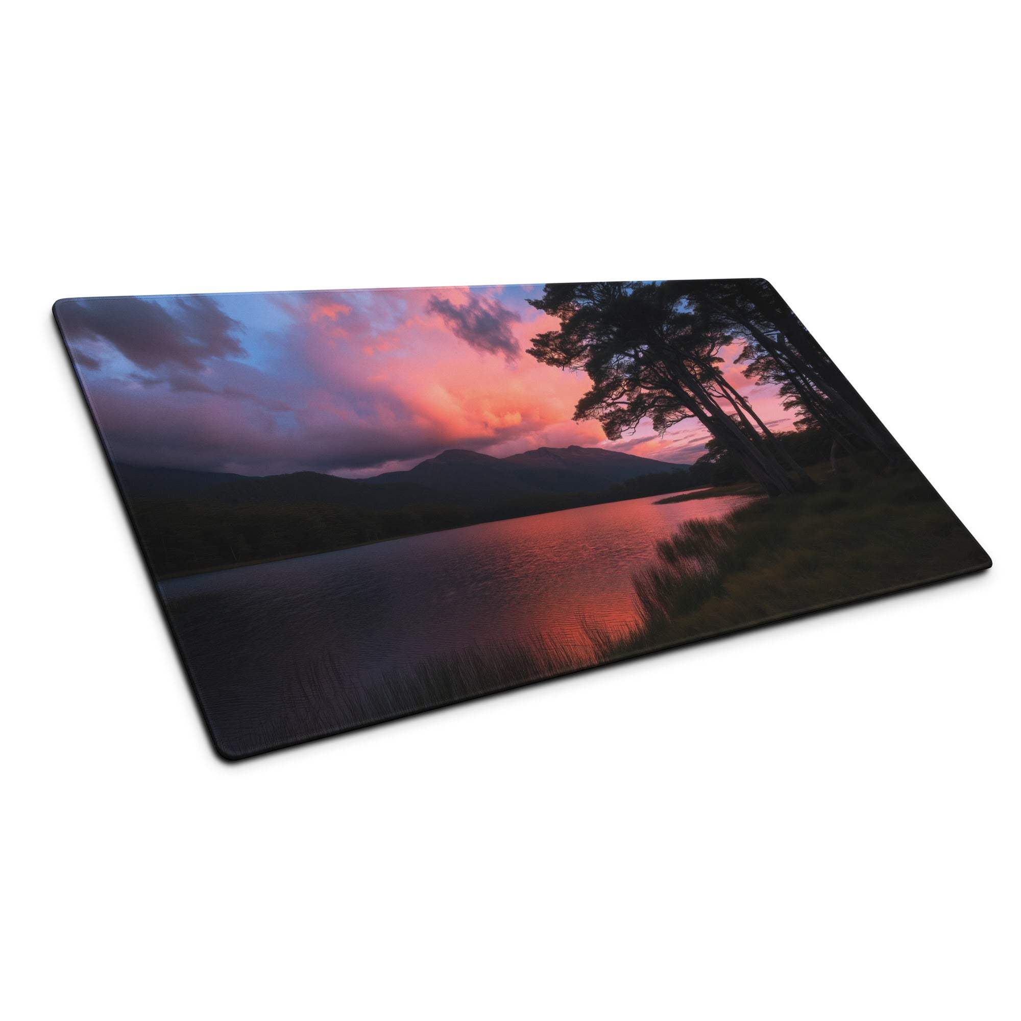 Large panoramic sunset gaming mouse pad with silhouetted trees over water