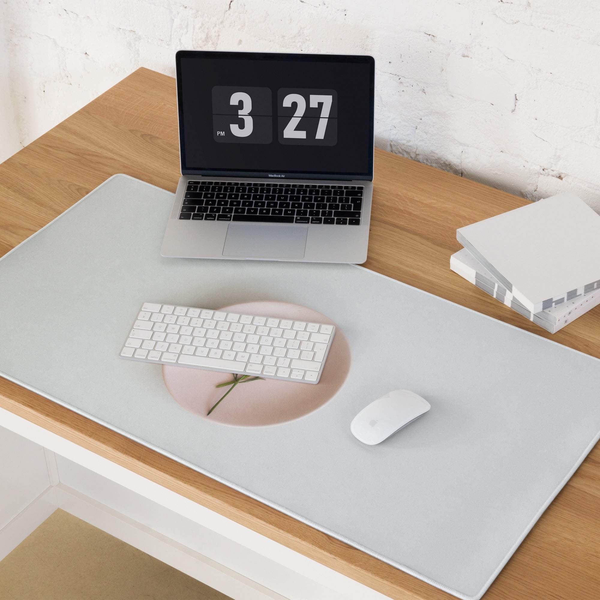 Sleek gray gaming mousepad with pink floral cutout and non-slip base