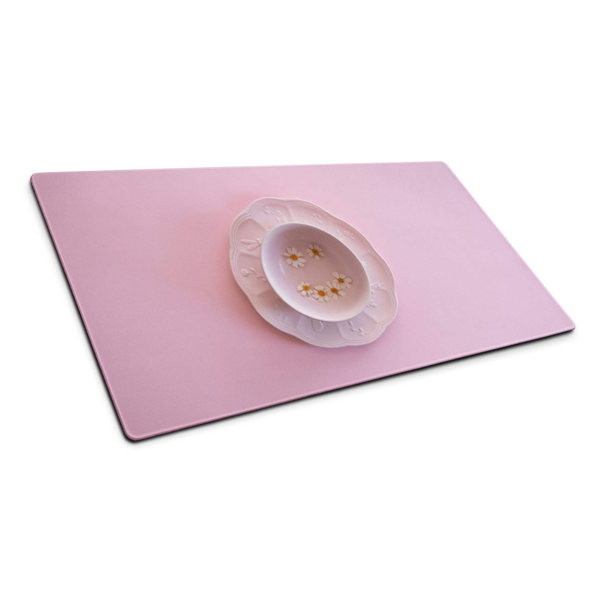 Delicate pink ceramic bowl with daisies on solid pink gaming mouse pad