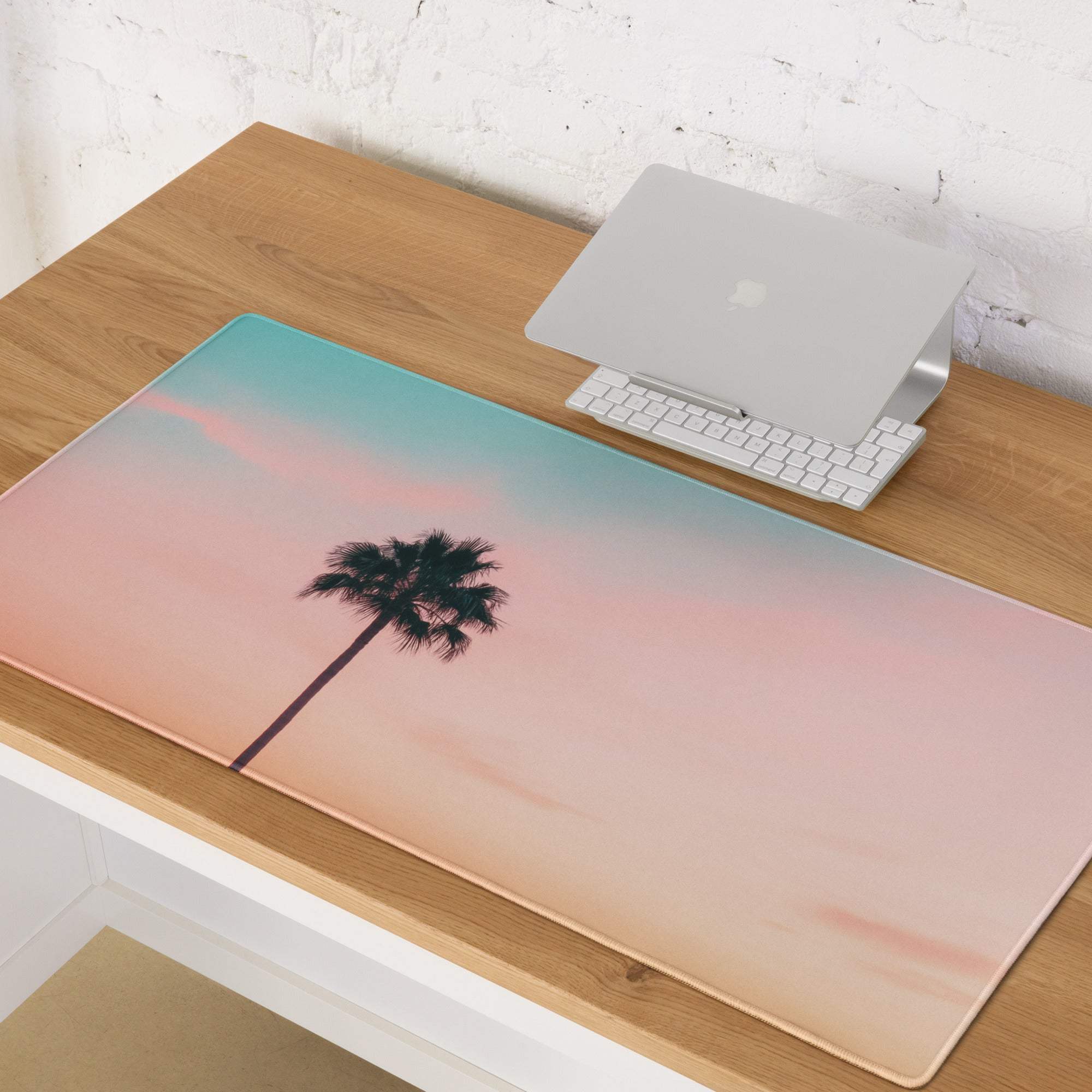 Pastel sunset palm tree gaming mouse pad with pink teal gradient and non-slip base