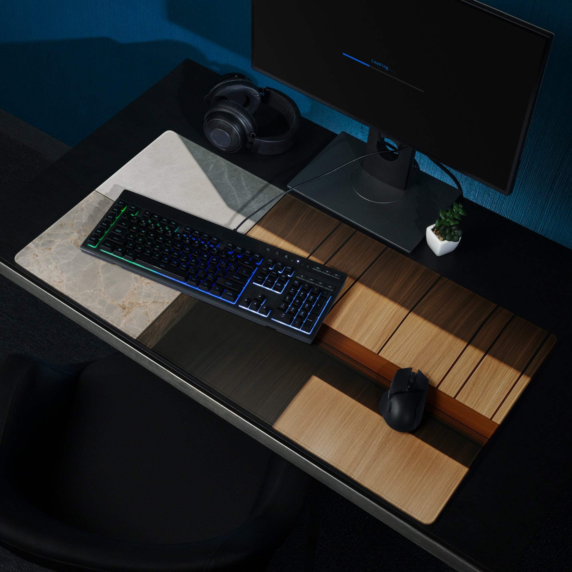 Black RGB gaming keyboard on modern marble wood mouse pad