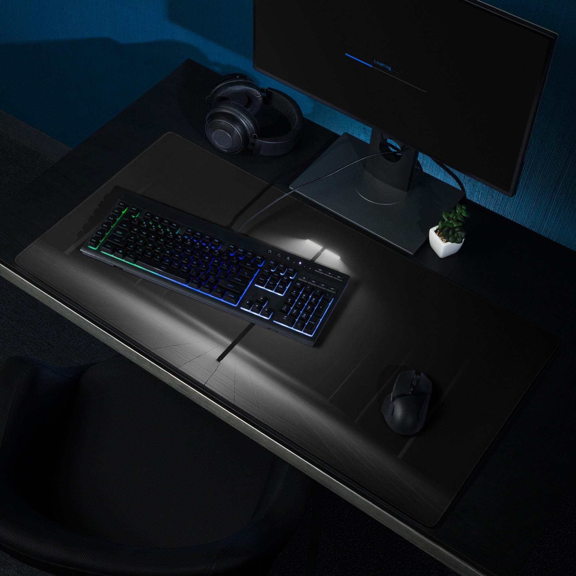 Black RGB gaming keyboard on large non-slip mouse pad