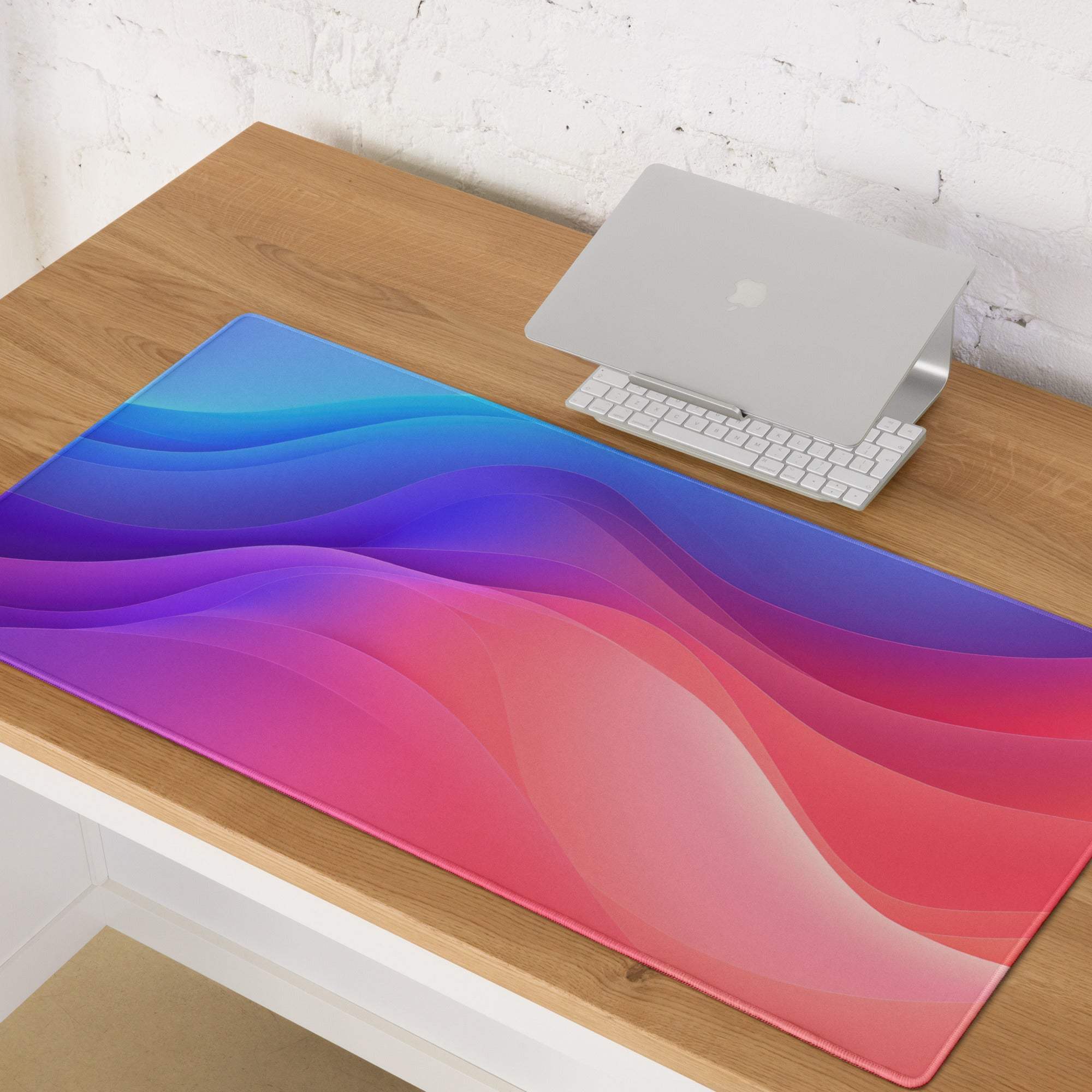 Vibrant gradient wave gaming mouse pad with glossy surface and stitched edges