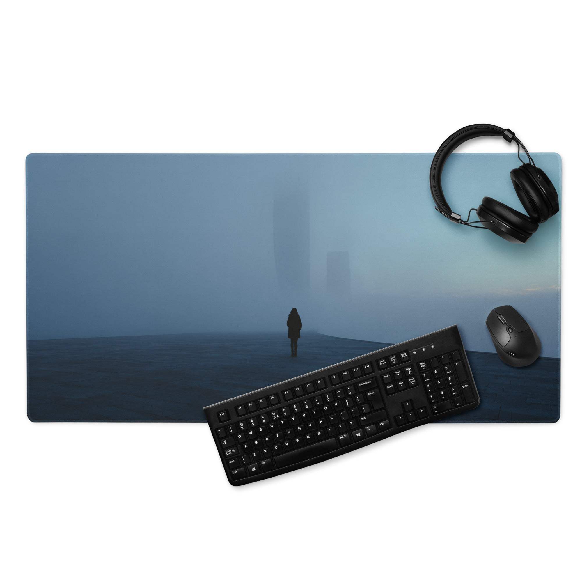 Blue foggy cityscape mousepad with lone figure walking toward distant buildings