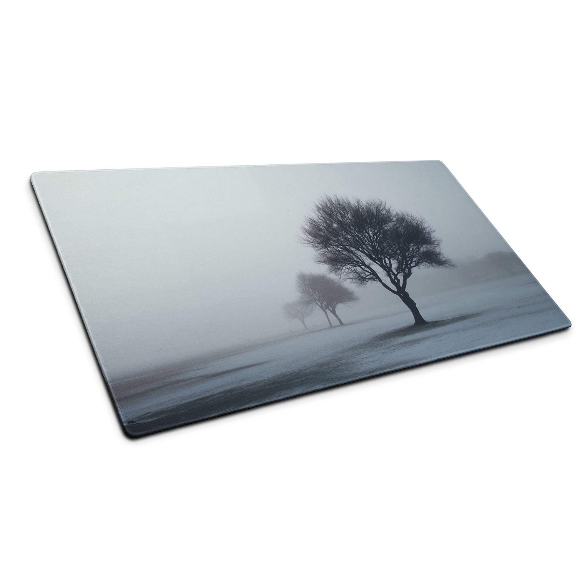 Grayscale misty forest landscape on large rectangular glass cutting board mouse pad