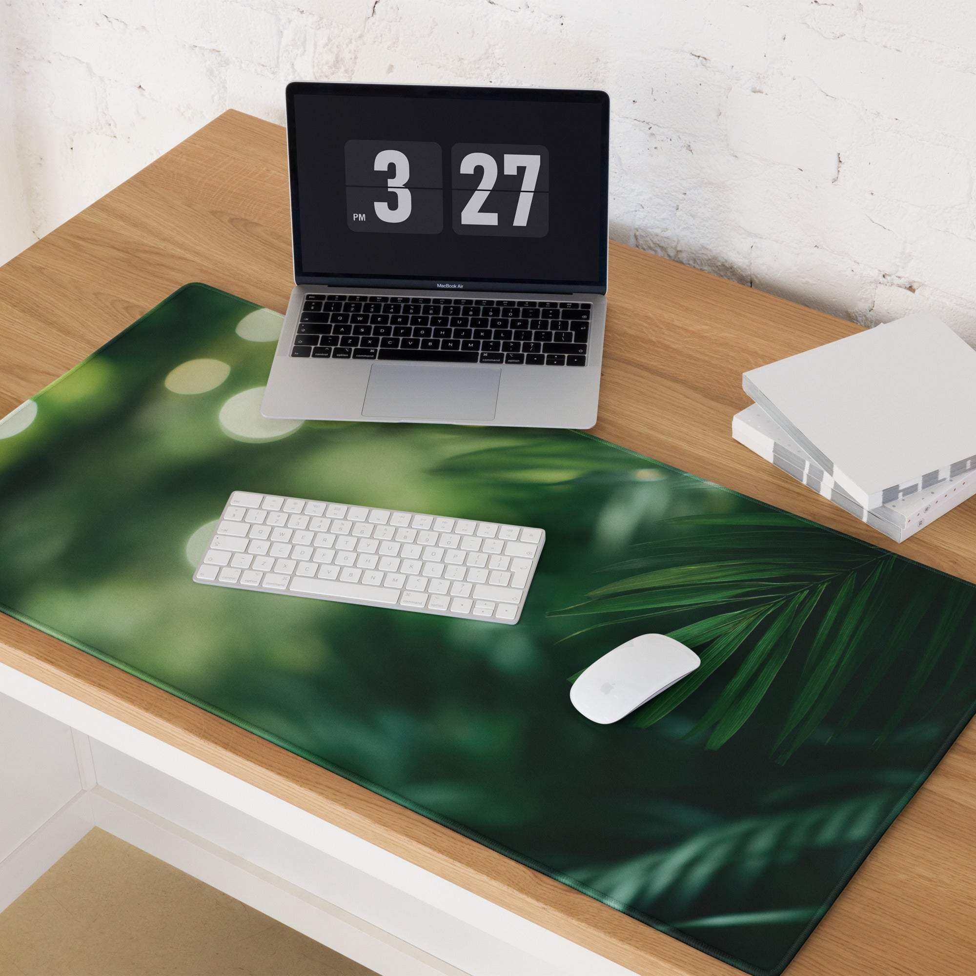 Green tropical leaf desk mat with non-slip backing and stitched edges
