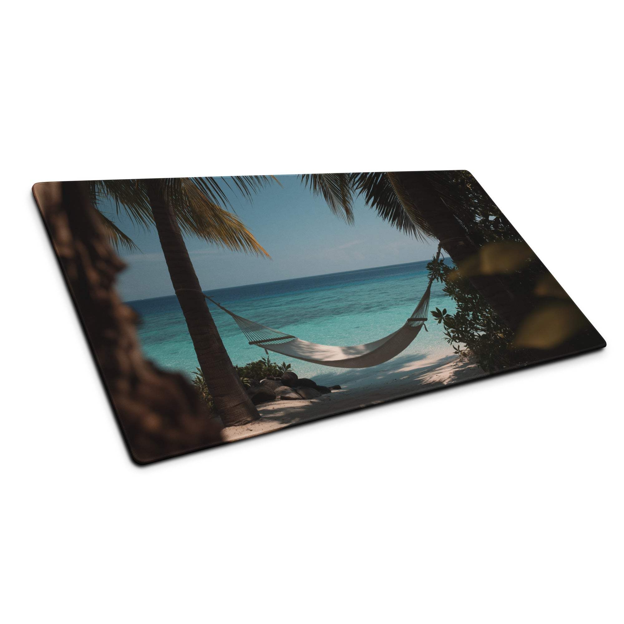 Beige hammock between palm trees over turquoise ocean on blue gaming mouse pad