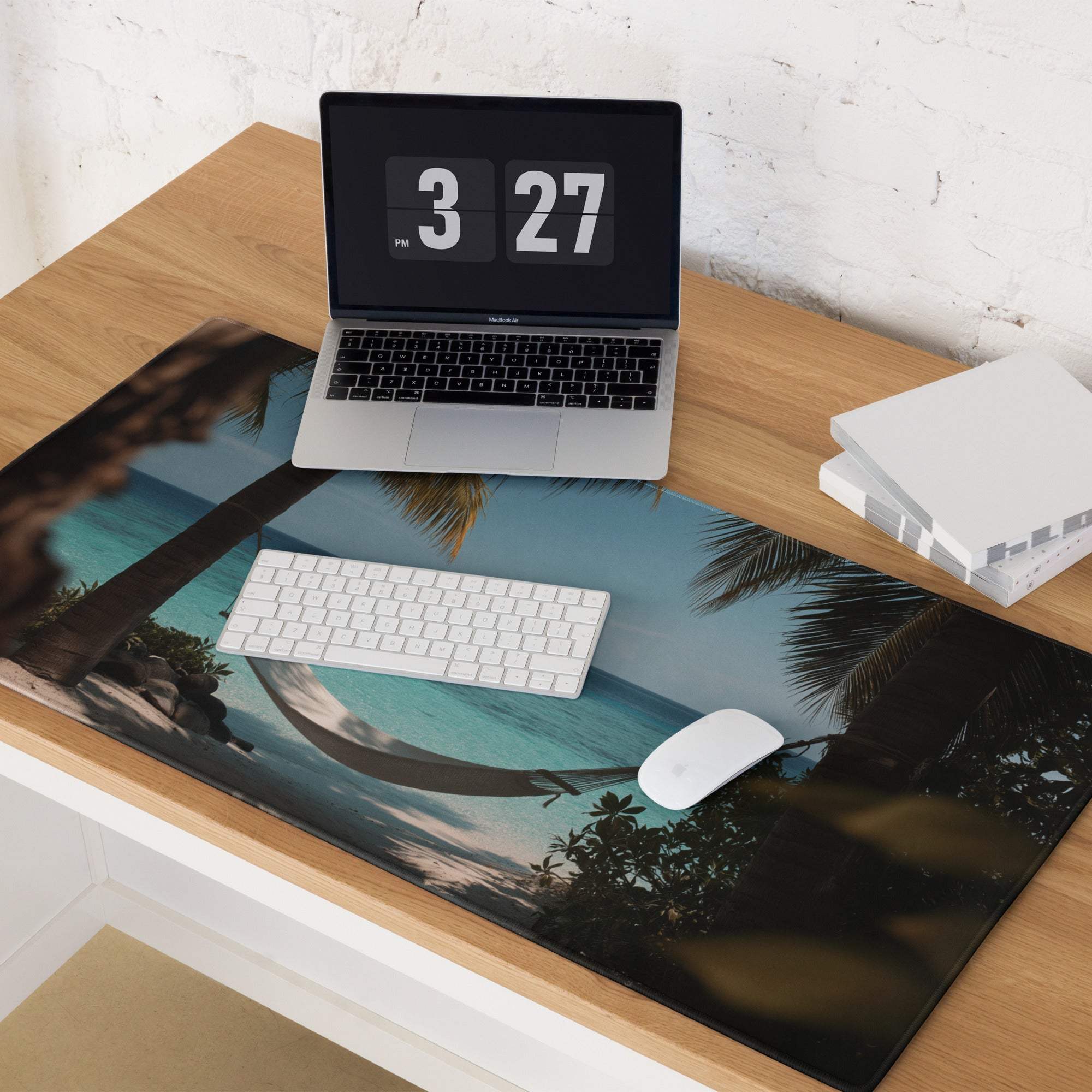 Beige laptop on Tropical Beach Paradise ocean blue gaming mouse pad showing 3:27 pm
