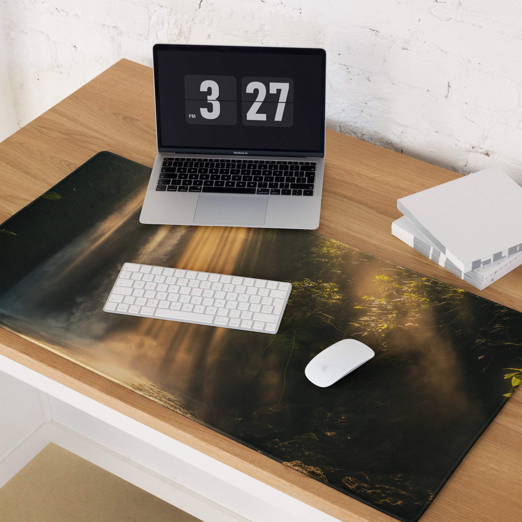 Black forest desk mat with golden sun rays and green foliage gaming mouse pad