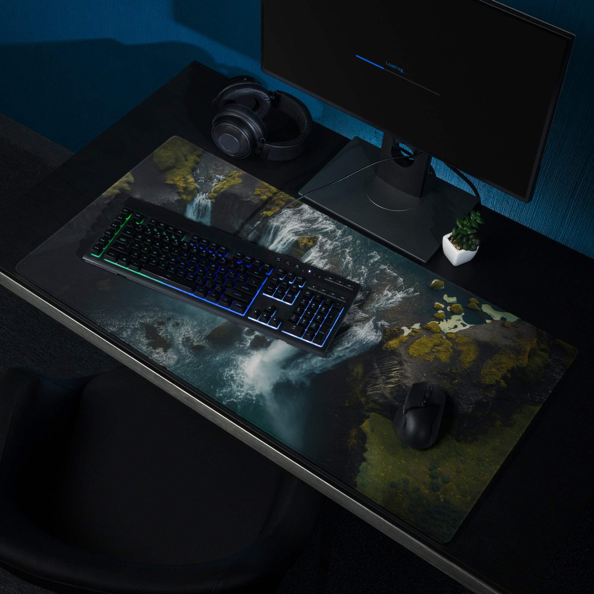 Black gaming mousepad with moody waterfall mossy rock design non-slip base