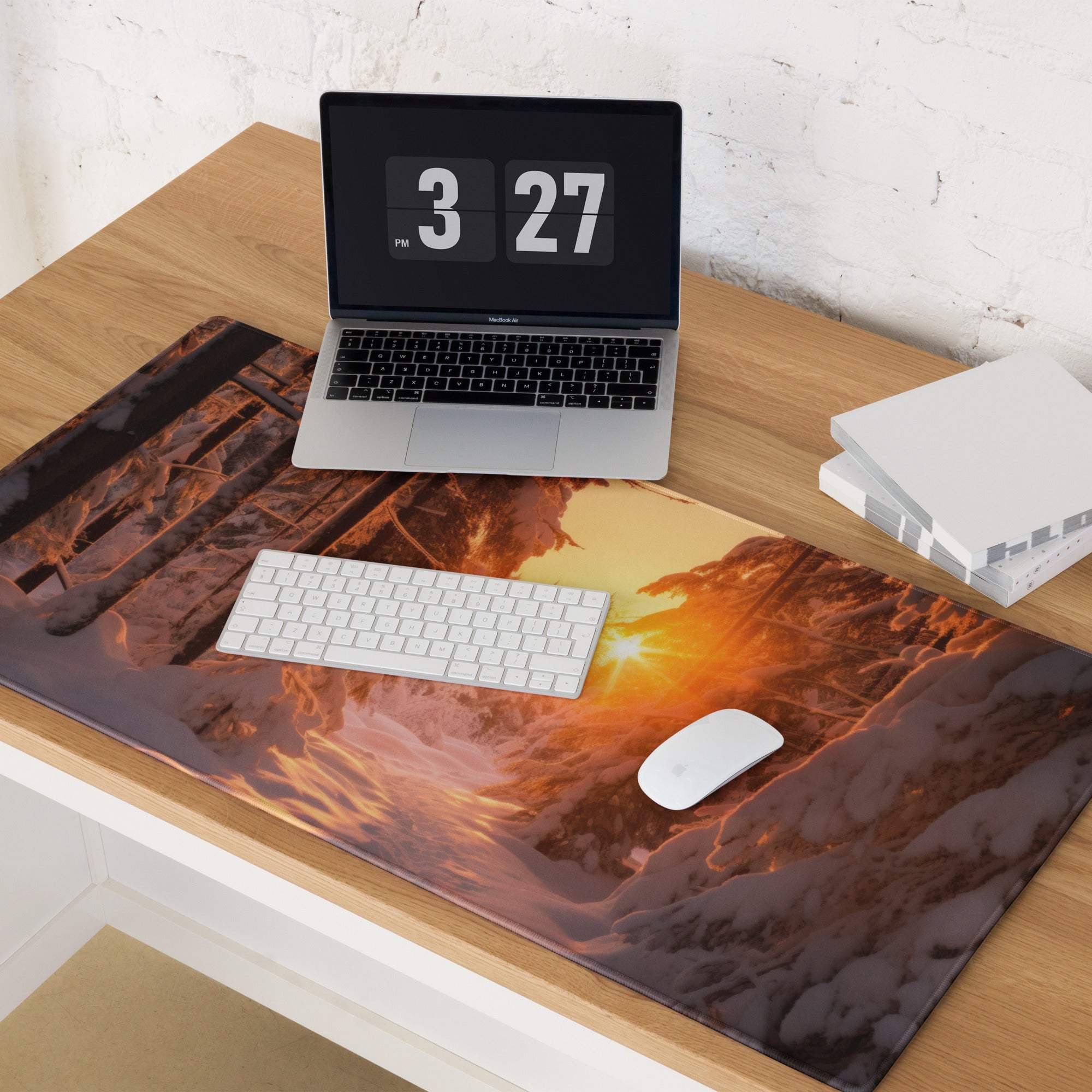 Vivid snowy forest sunrise gaming mouse pad with orange glow and non-slip backing