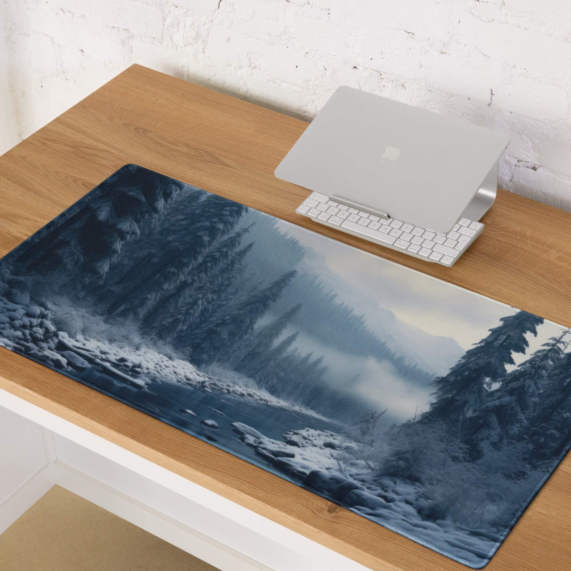 Wintry blue forest gaming mouse pad with snow trees and misty mountains