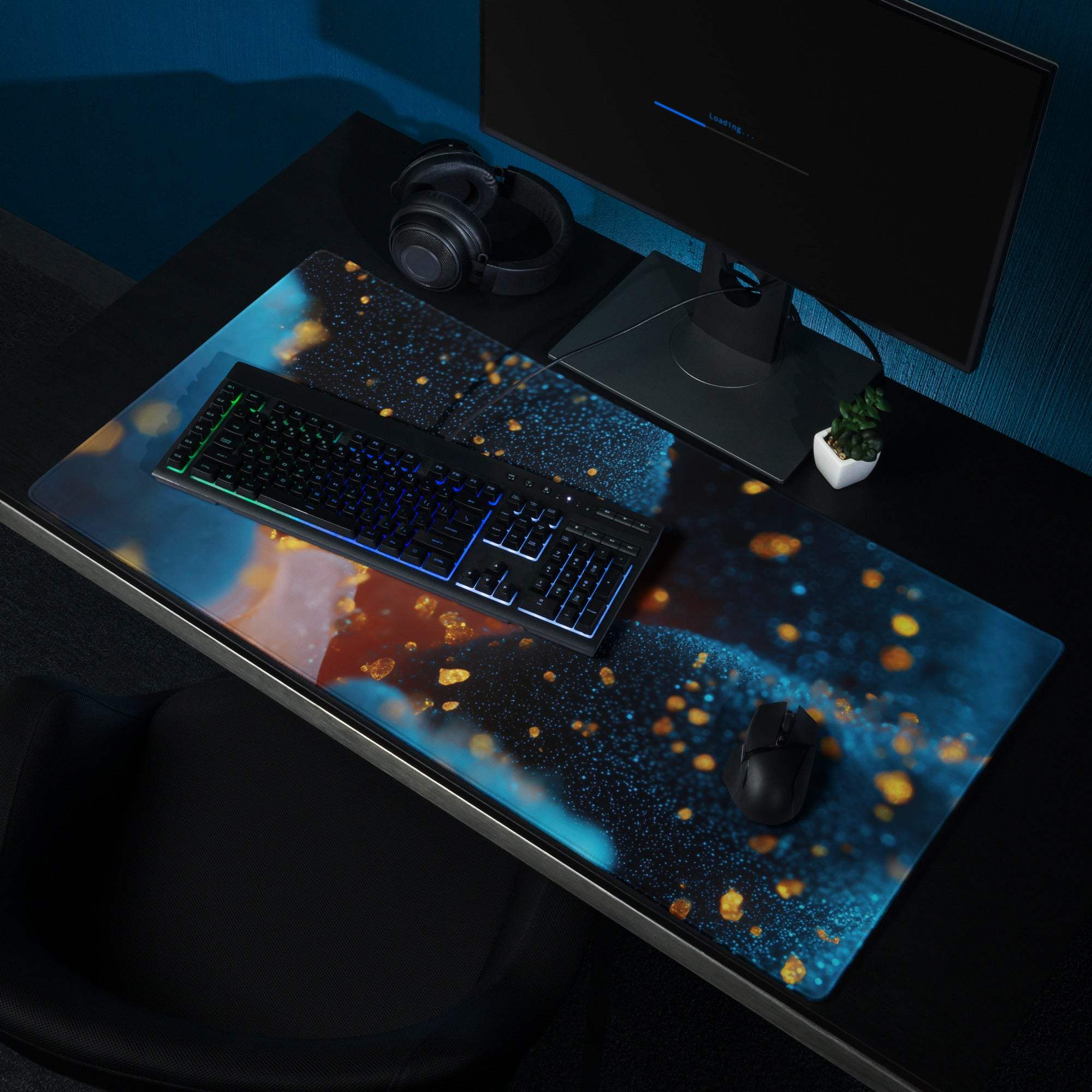 Sleek large non-slip ocean blue nebula gaming mouse pad with glowing particles