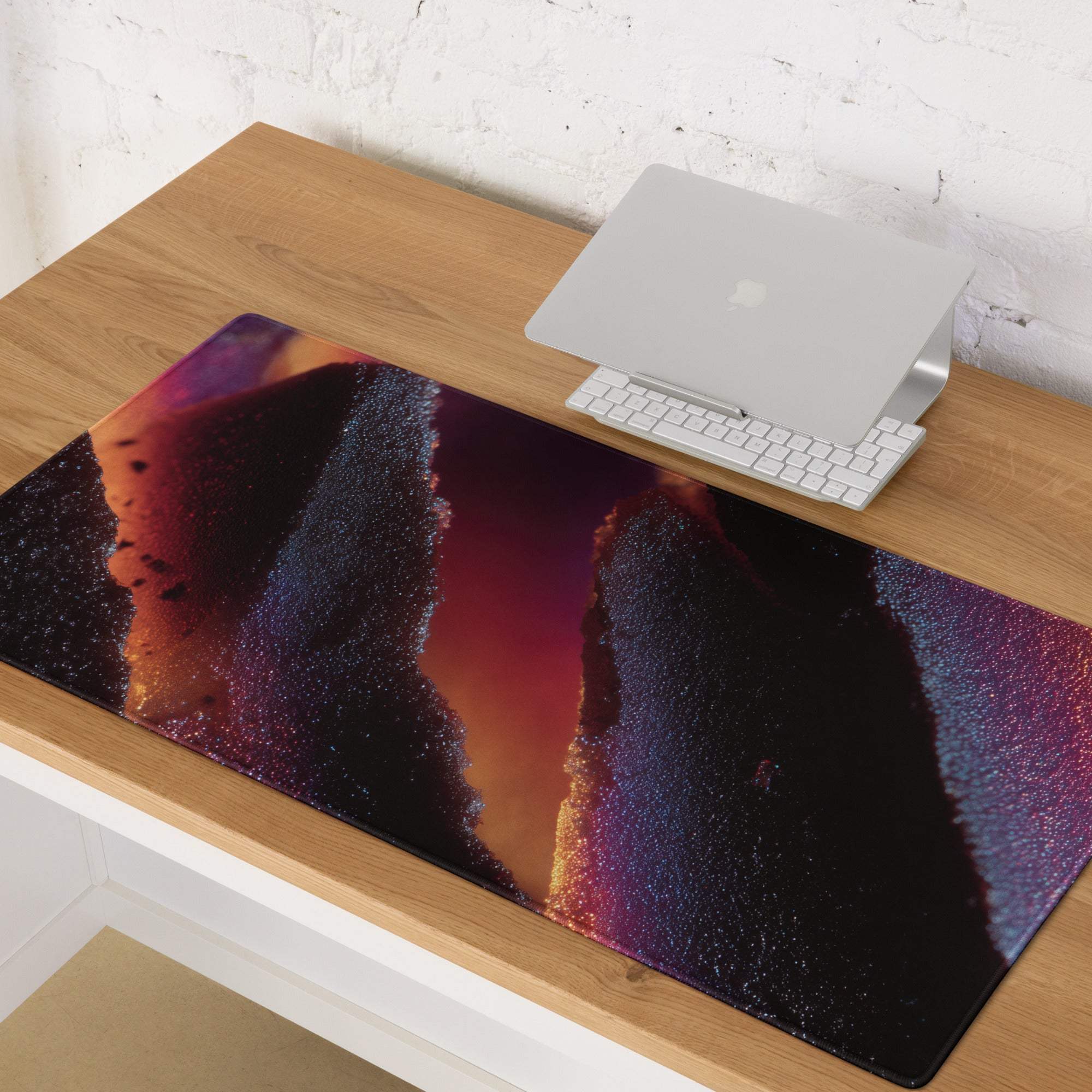 Vibrant nebula gaming mouse pad with purple orange gradients, edge stitching, non-slip base