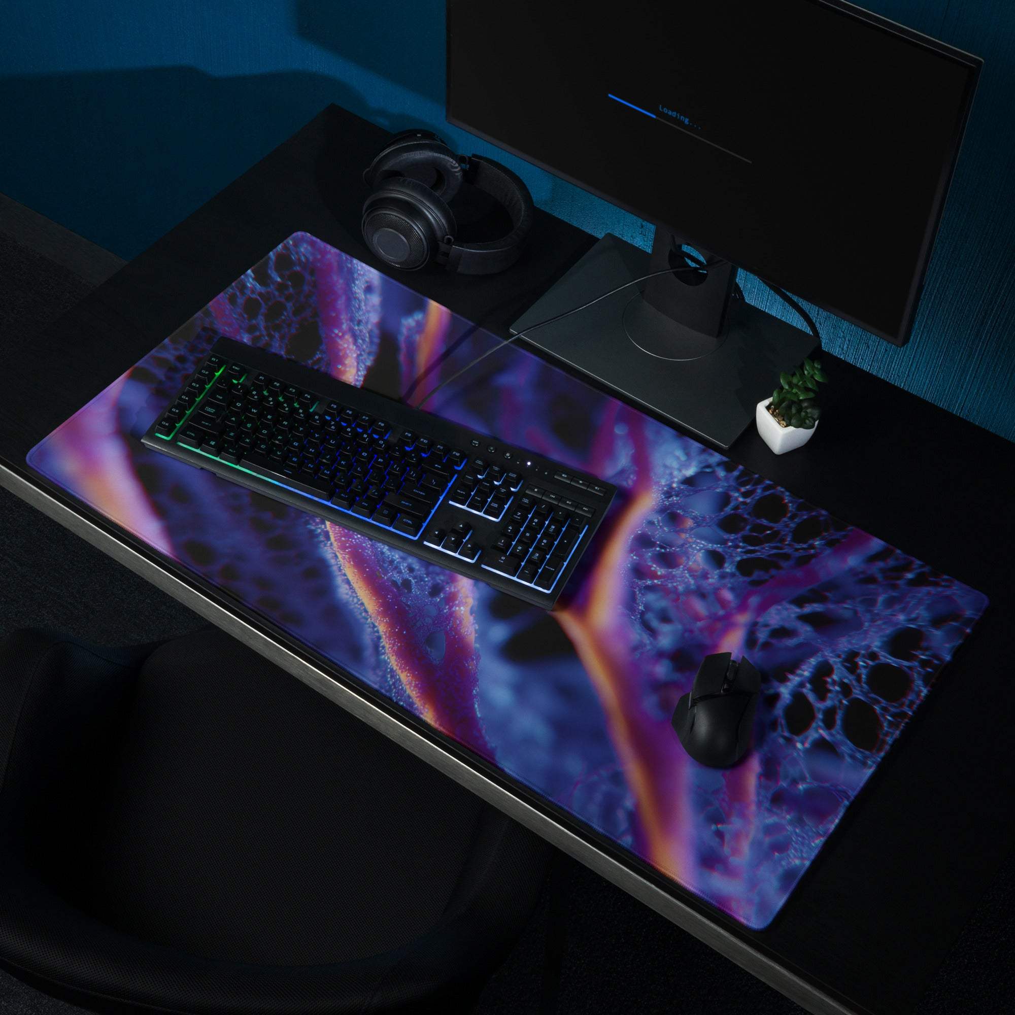 Vibrant cosmic nebula gaming mousepad in purple blue orange neon patterns