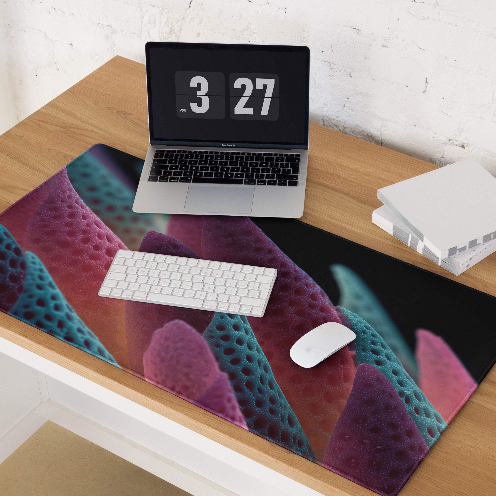 Vibrant coral-textured gaming mousepad with purple-teal gradient and neon leaves art