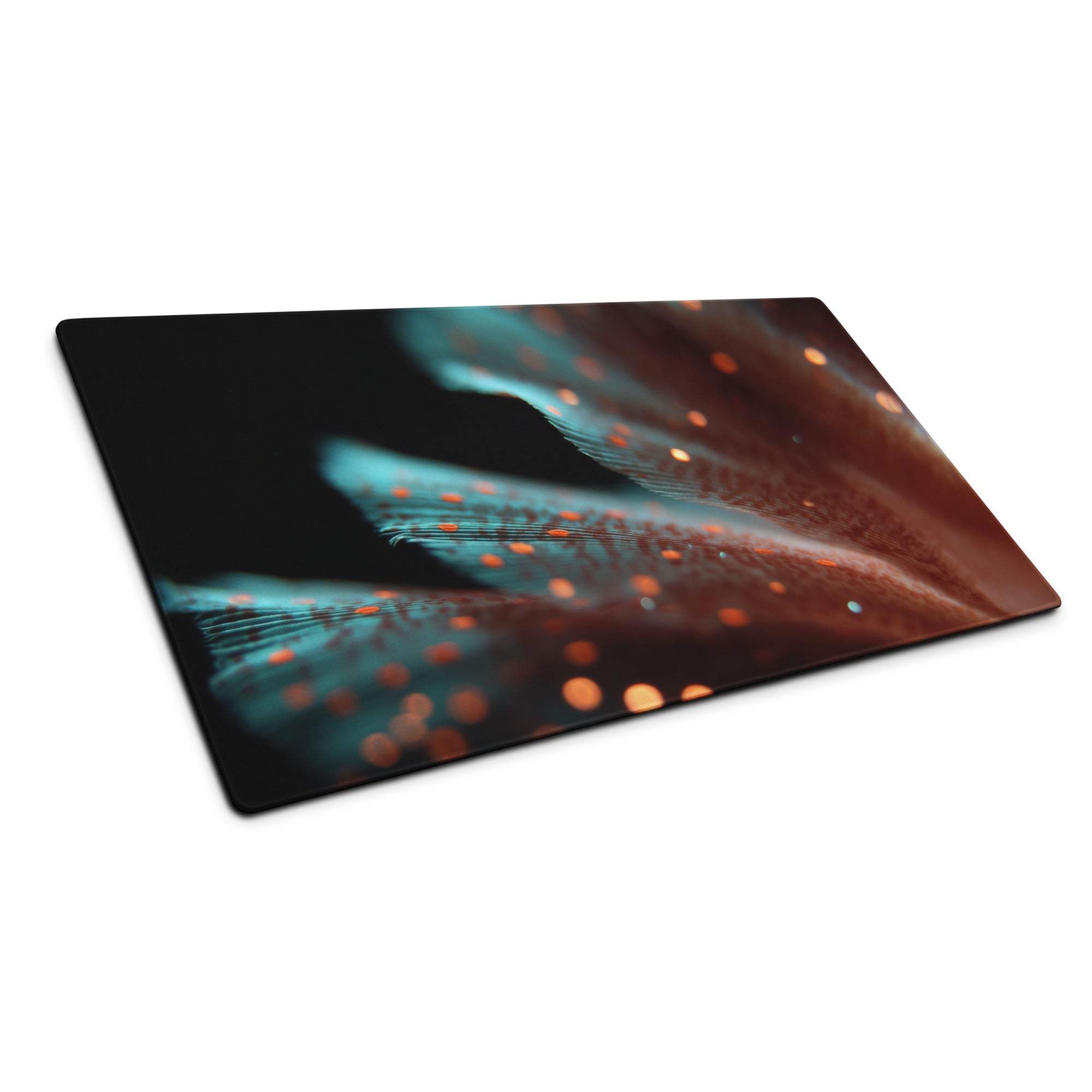 Large gaming mouse pad with teal brown feathers and orange glow on black