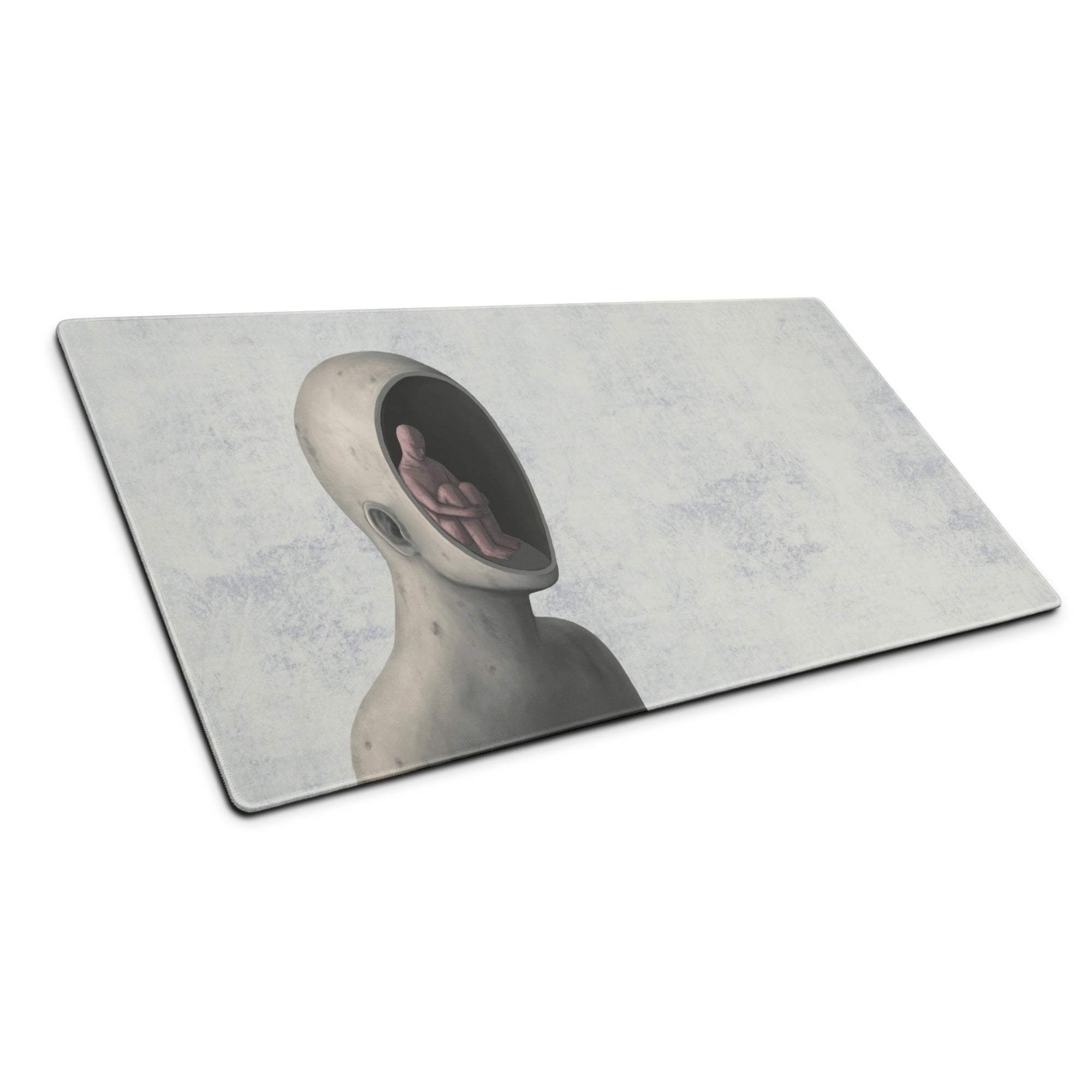 Rectangular gray and blue surreal mouse pad with abstract humanoid figure and small human inside head for modern office use