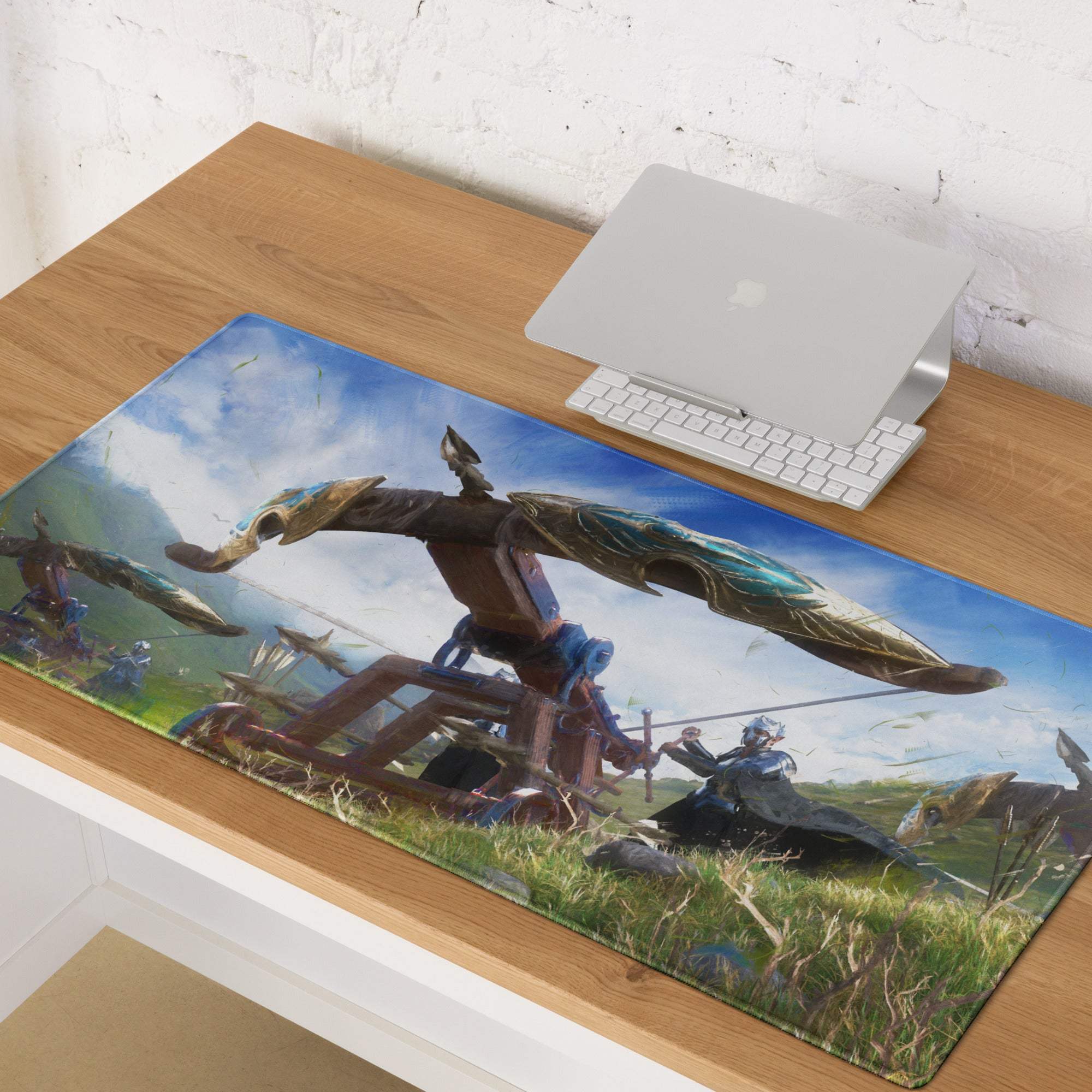 Azure fantasy battle mouse pad with blue accents and golden winged medieval siege engine on grassy battlefield design