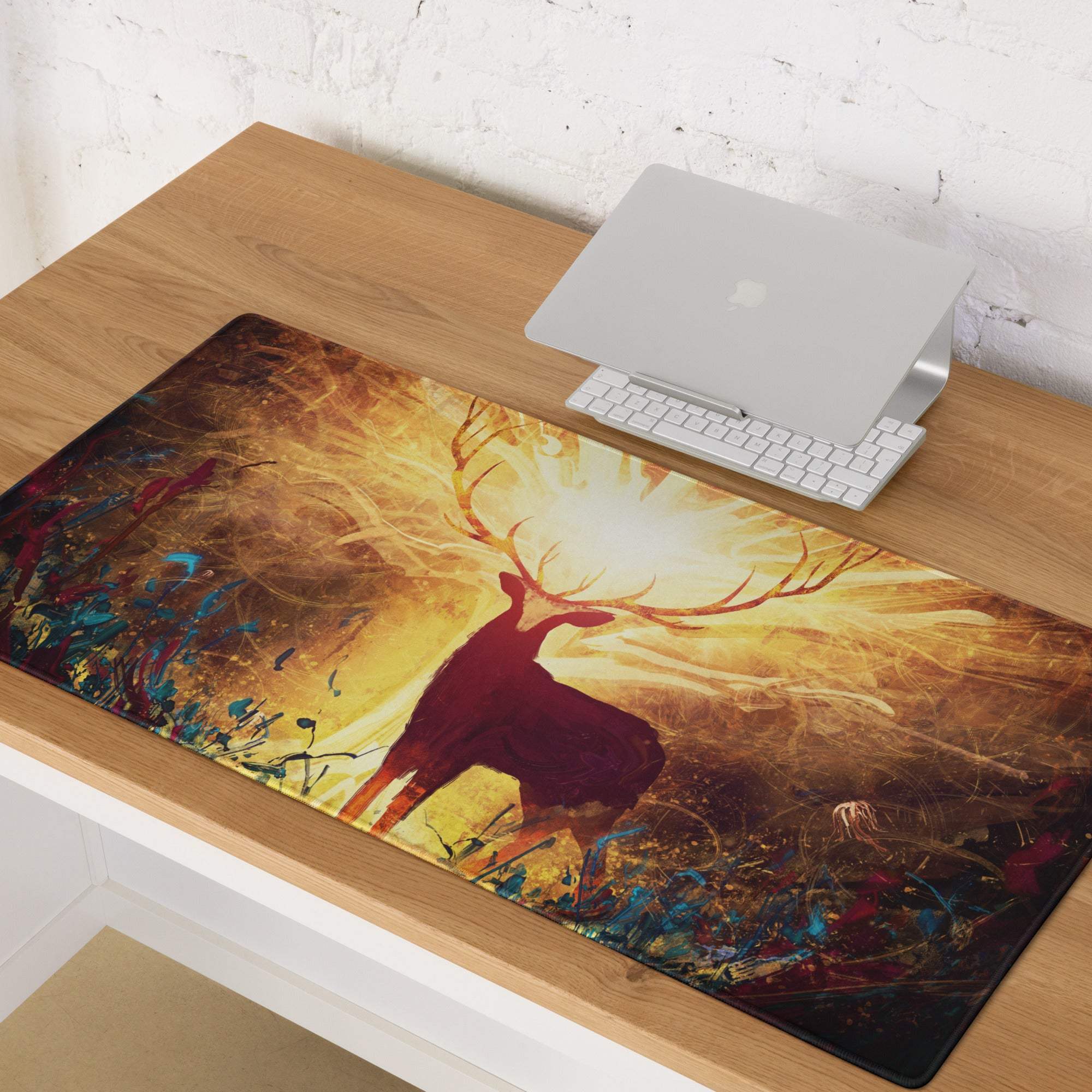 Glowing deer silhouette gaming mouse pad with glossy finish featuring vibrant stag with glowing antlers on warm orange gold background