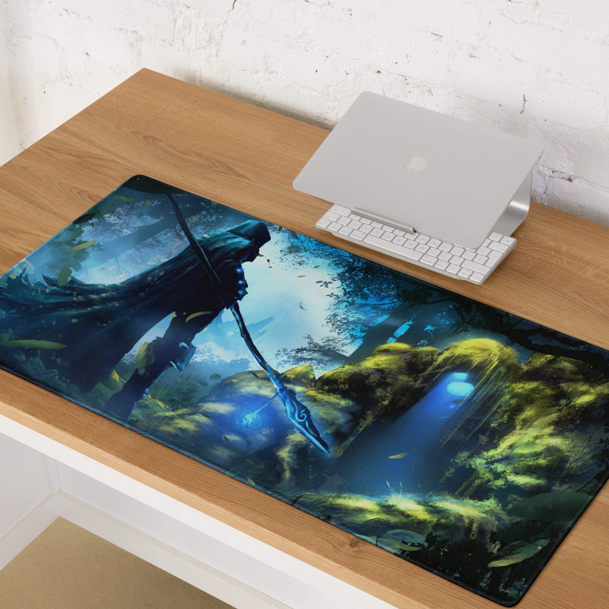 Blue and green fantasy-themed gaming mouse pad featuring a hooded figure with glowing staff in enchanted forest design