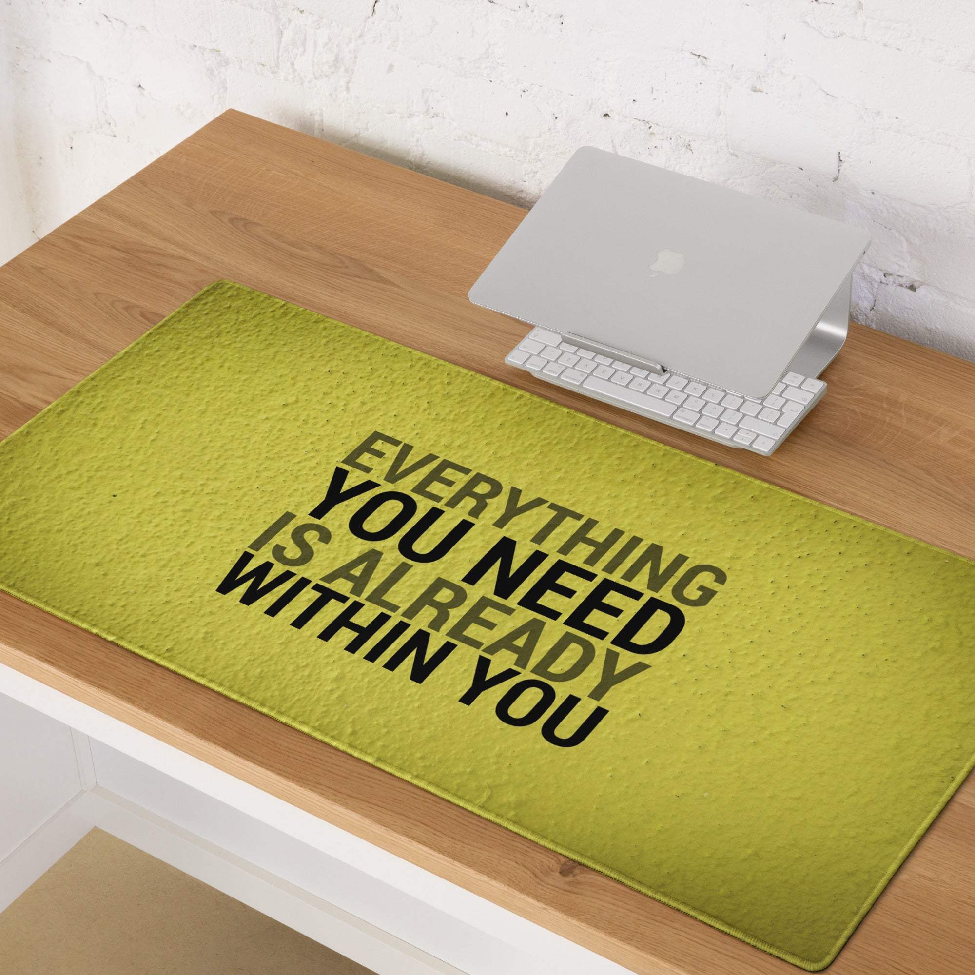 Bold yellow motivational desk pad with lime green textured fabric and black text everything you need is already within you