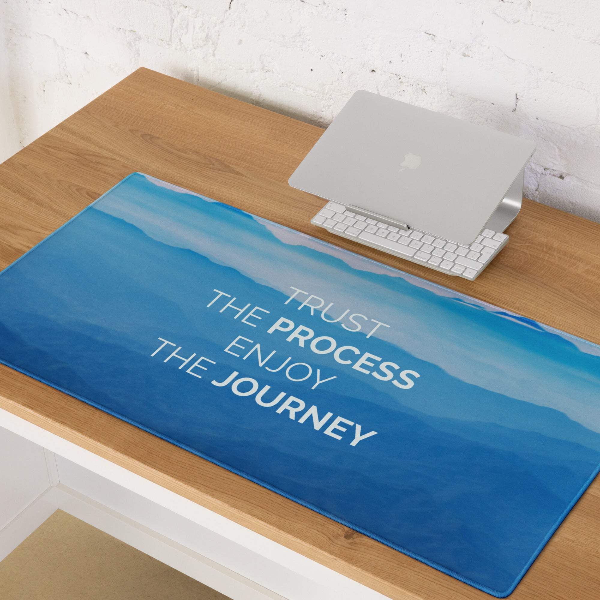 Blue gradient desk mouse pad with white motivational text trust the process enjoy the journey for office and gaming use