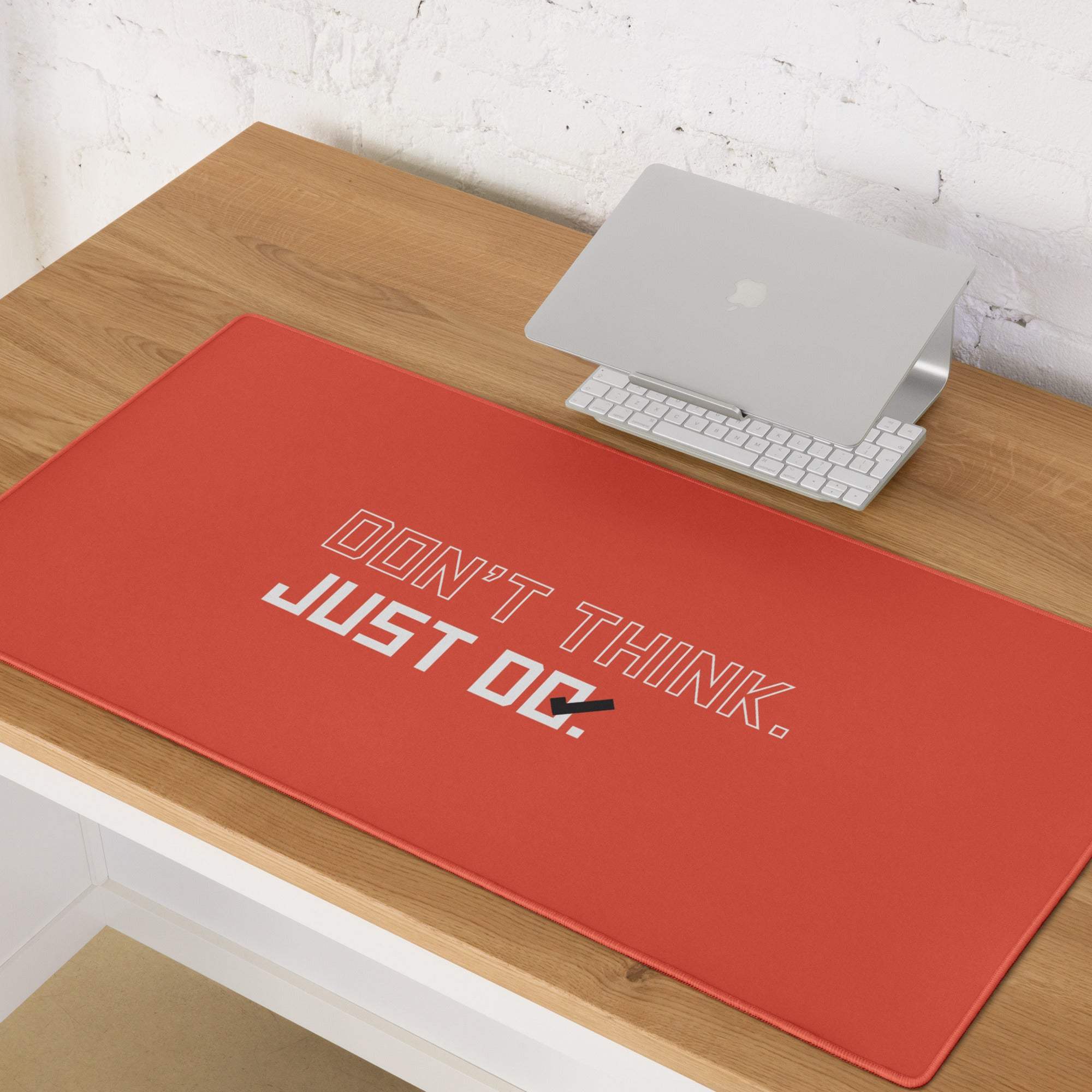 Bold red orange motivational mouse pad with white and black typography design for office desk use