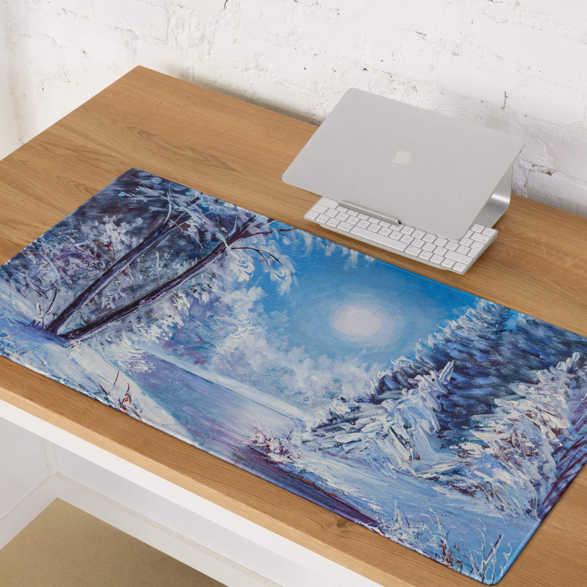 Winter forest desk pad featuring a blue and white oil painting of snow-covered trees, frozen lake, and glowing moon