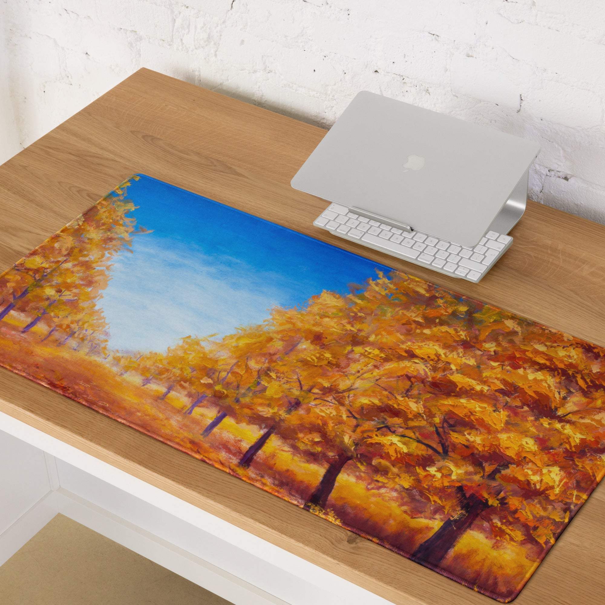 Rectangular autumn leaves desk pad with vibrant golden trees and blue sky print on smooth oil canvas surface