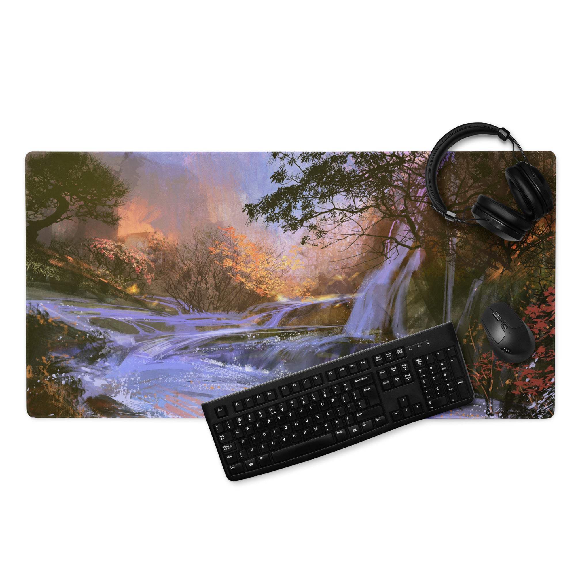 A rectangular purple blue fabric gaming mousepad with vibrant waterfall and autumn forest landscape design under sunset