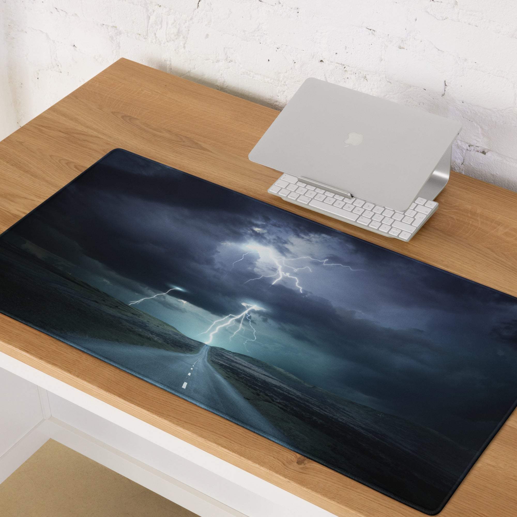 Dark blue and black storm-themed gaming mousepad with vivid lightning bolts for an immersive desk setup