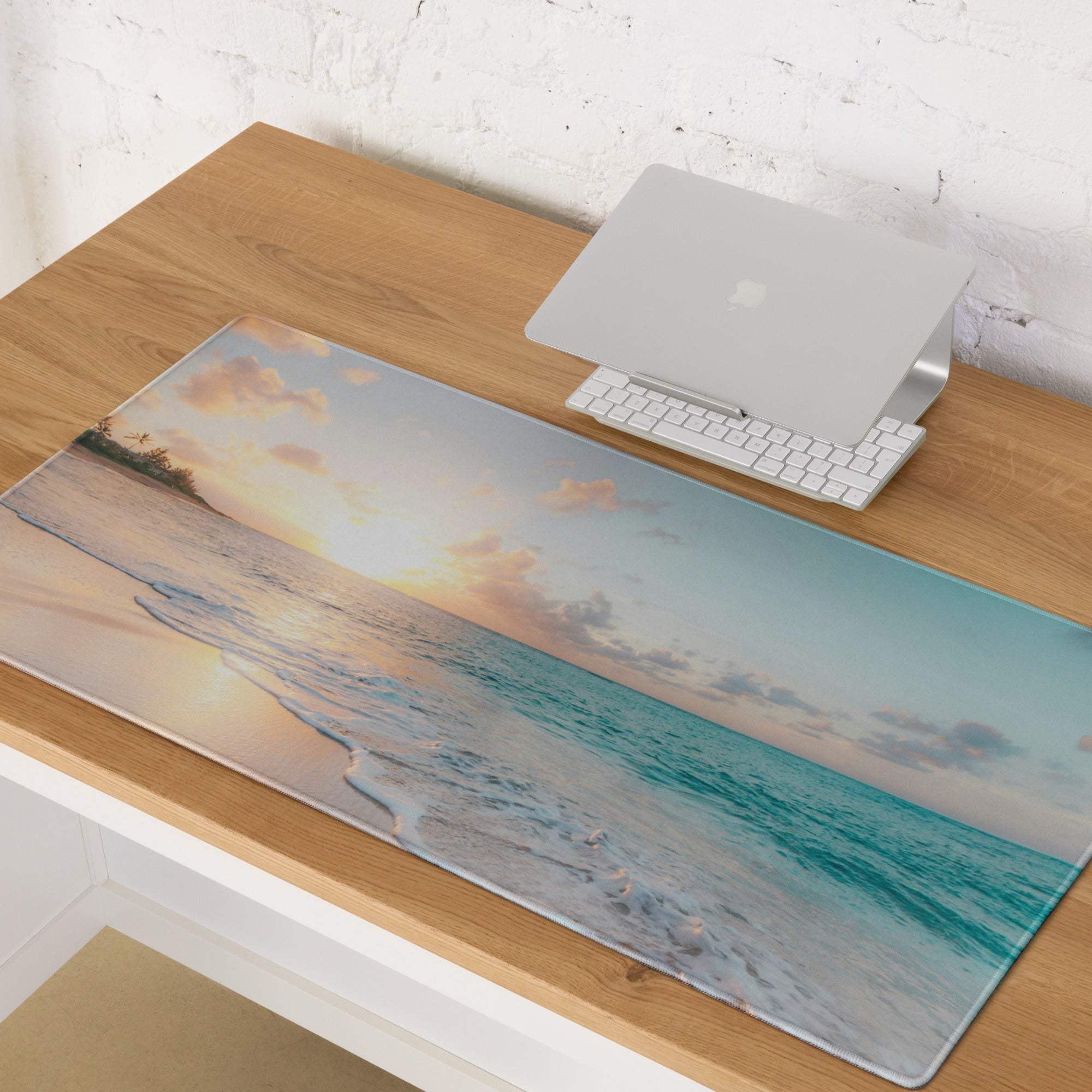 Beige and teal ocean sunset scene on a soft textured rectangular mousepad for gaming and modern desk use