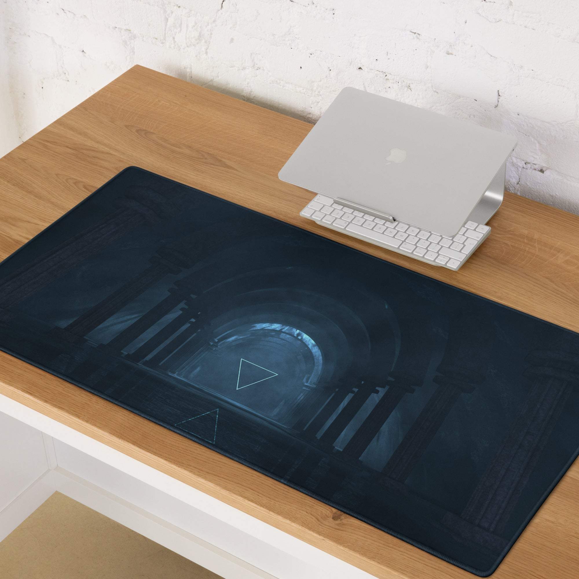 Midnight blue neon geometry gaming mouse pad with glowing tunnel design and white triangular accents