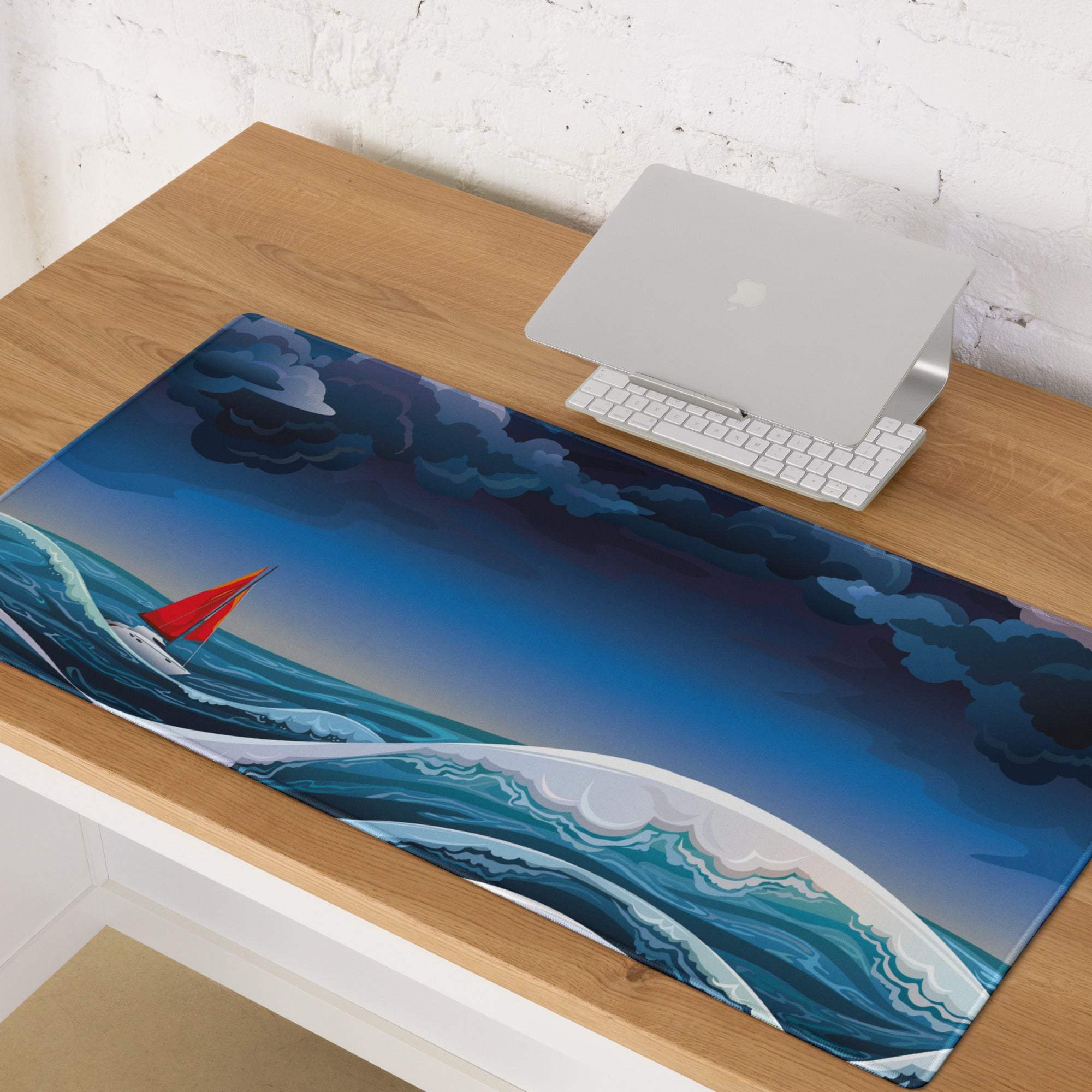 A glossy rectangular mouse pad with a red-sailed sailboat on blue waves under a dramatic sky for gaming desks