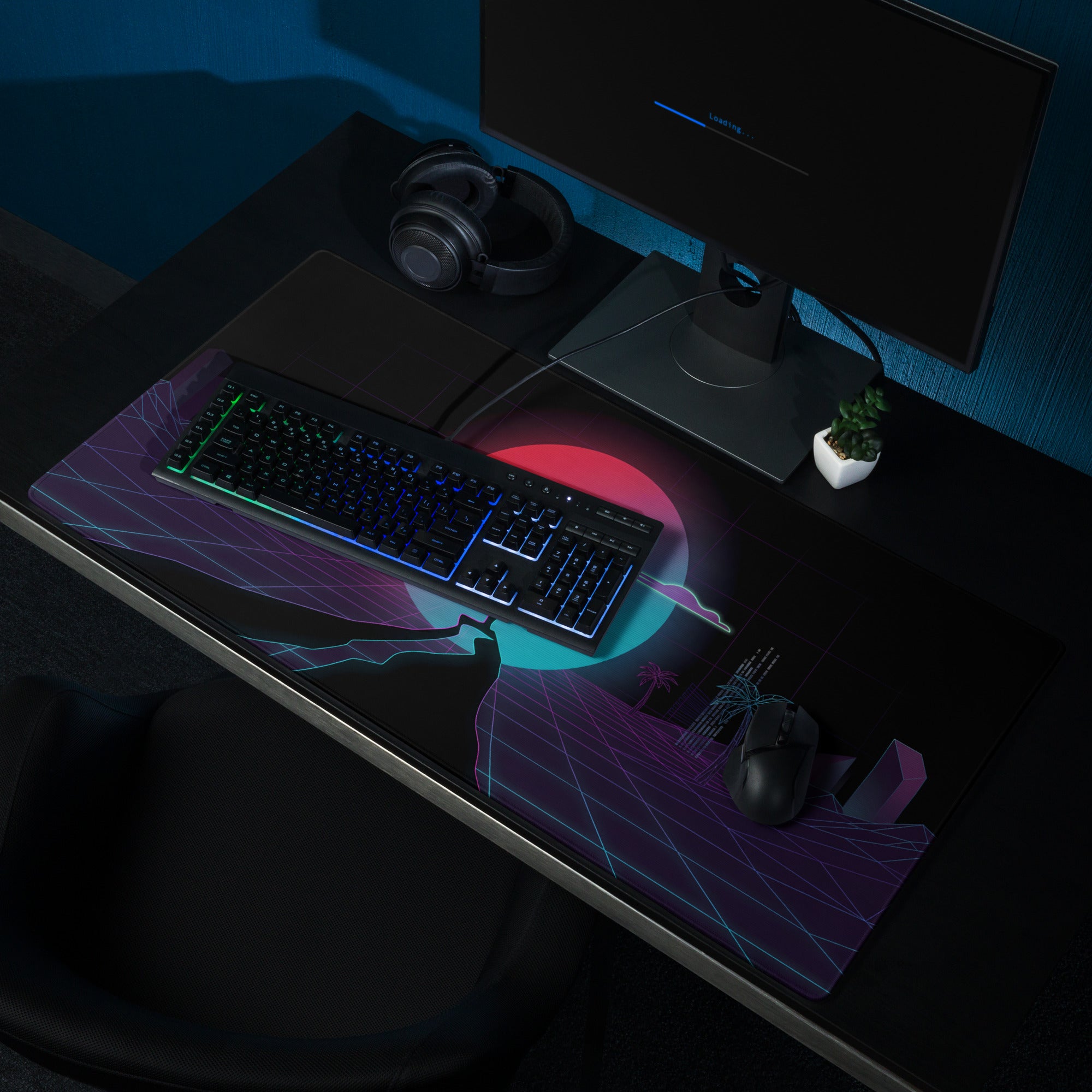 A sleek black gaming mouse pad with vibrant neon pink purple cyberpunk patterns for vaporwave desk setups