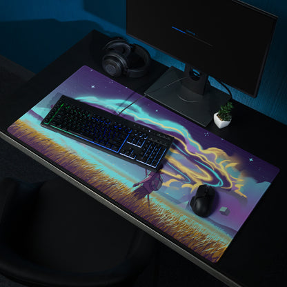 Vibrant purple and teal cosmic gaming mouse pad with stylized character in golden grass under swirling auroras