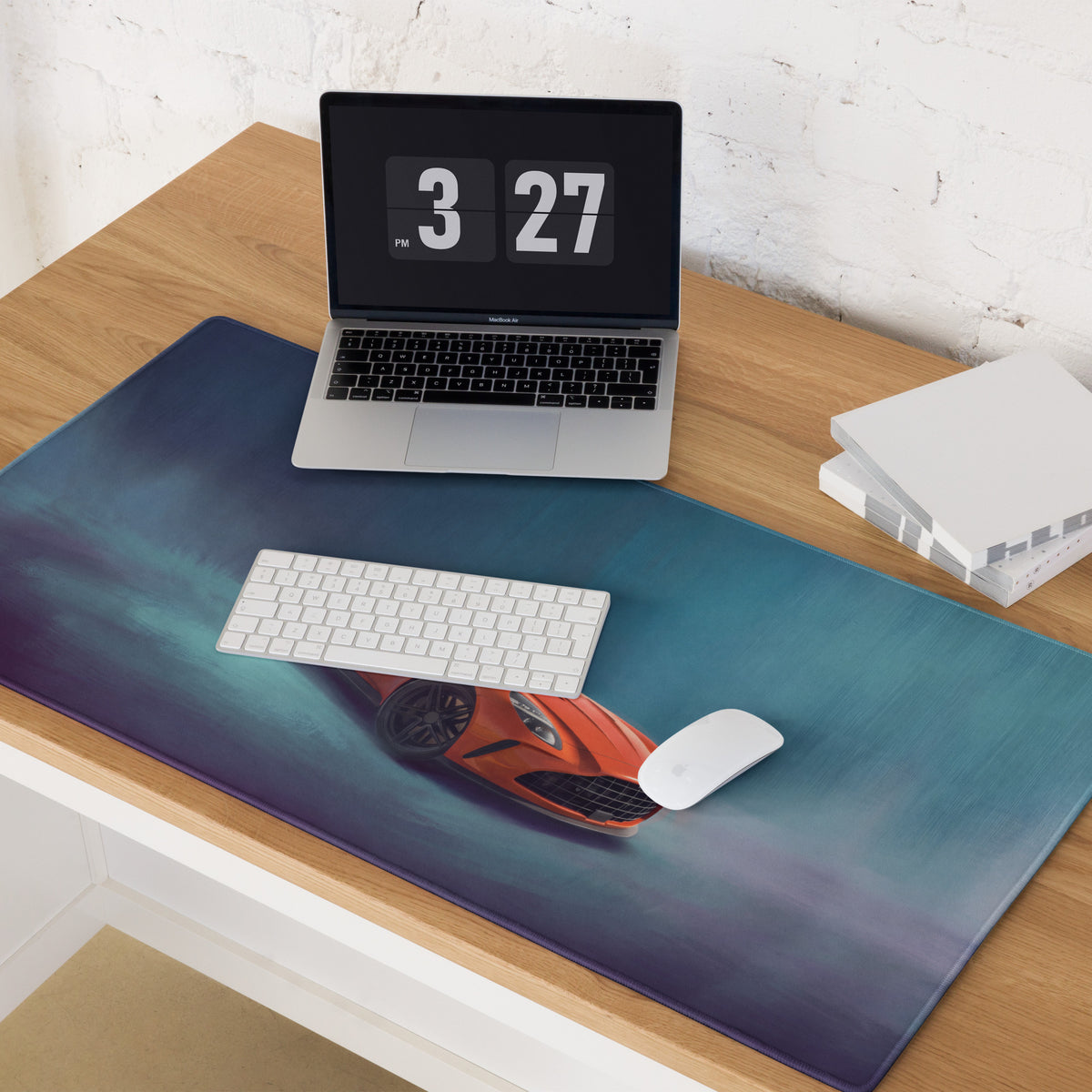 Aston Martin Vantage inspired sunset orange sports car graphic on a large blue gradient xl gaming mousepad
